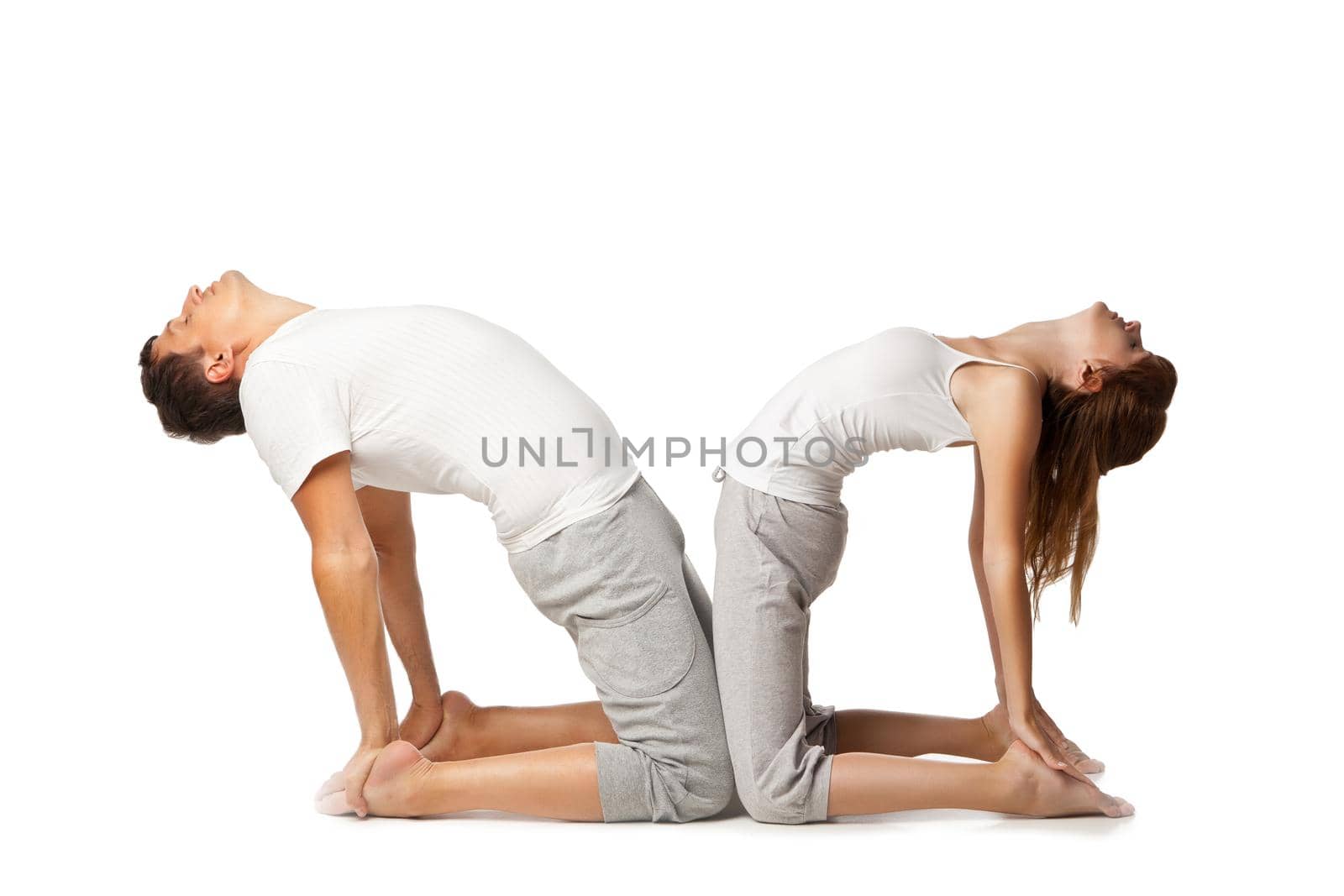 Healthy couple in yoga position on white by Julenochek