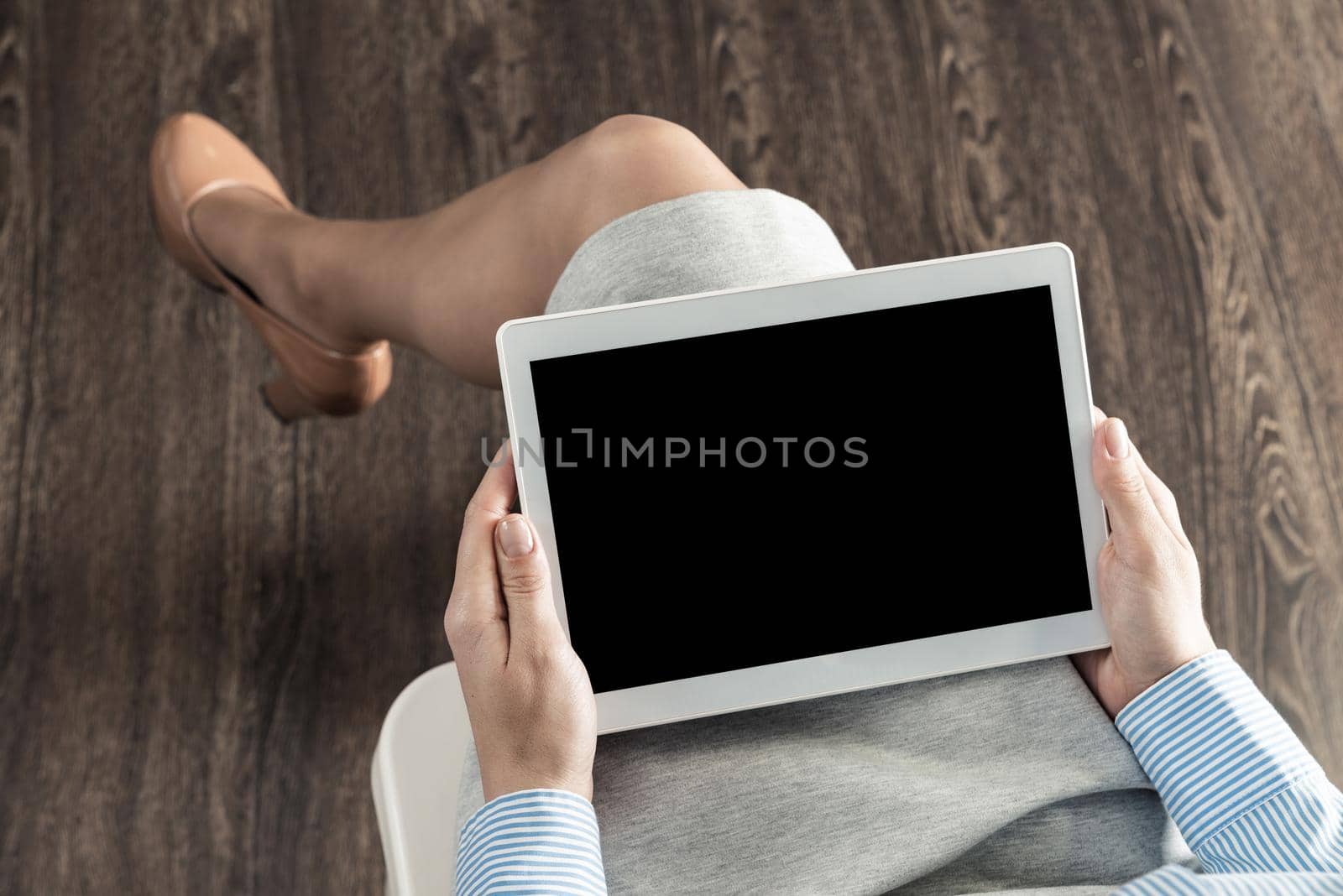 close-up of female hands with a computer tablet