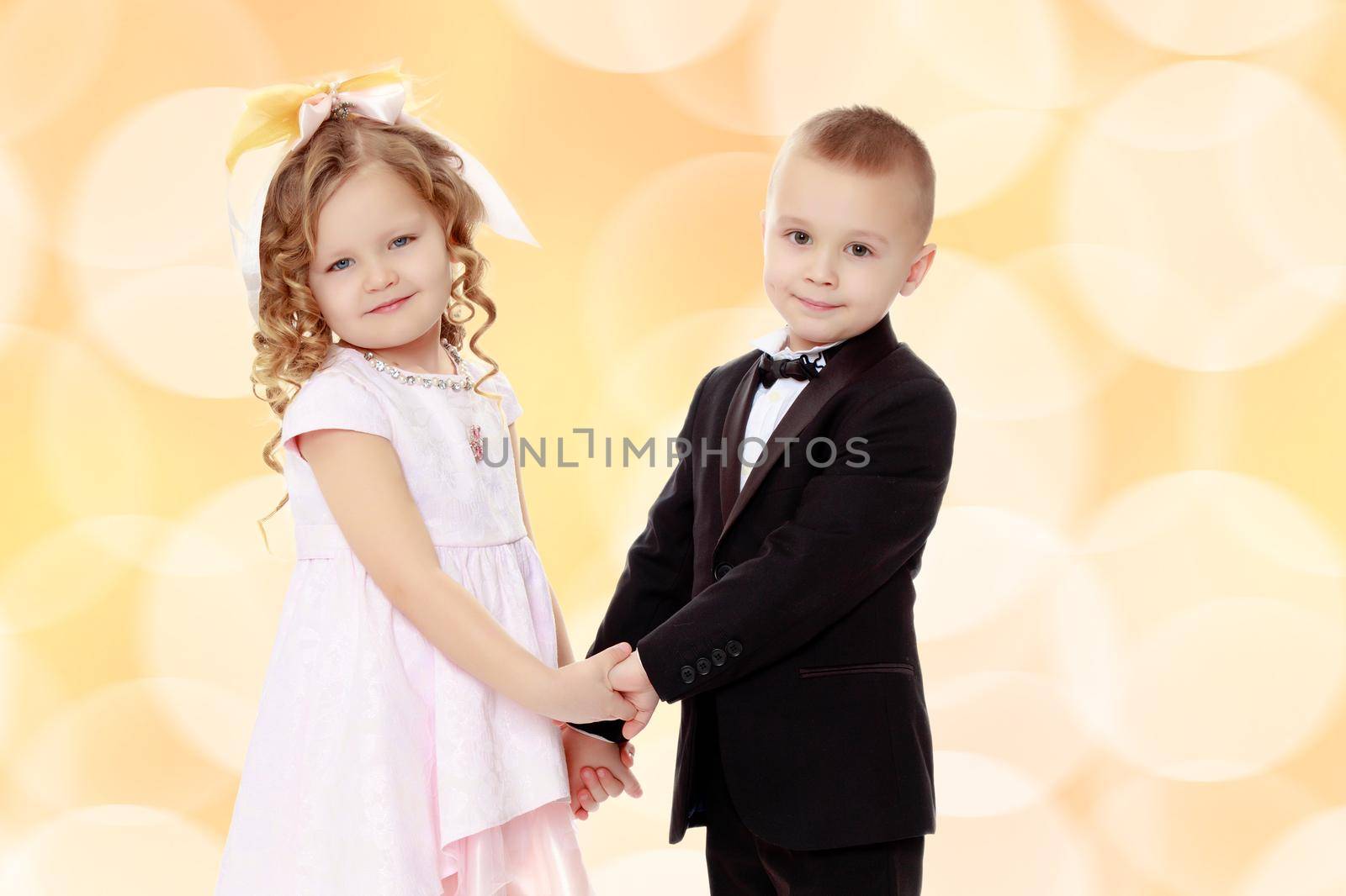 little cute boy and girl hugging playing on white background, happy family smiling