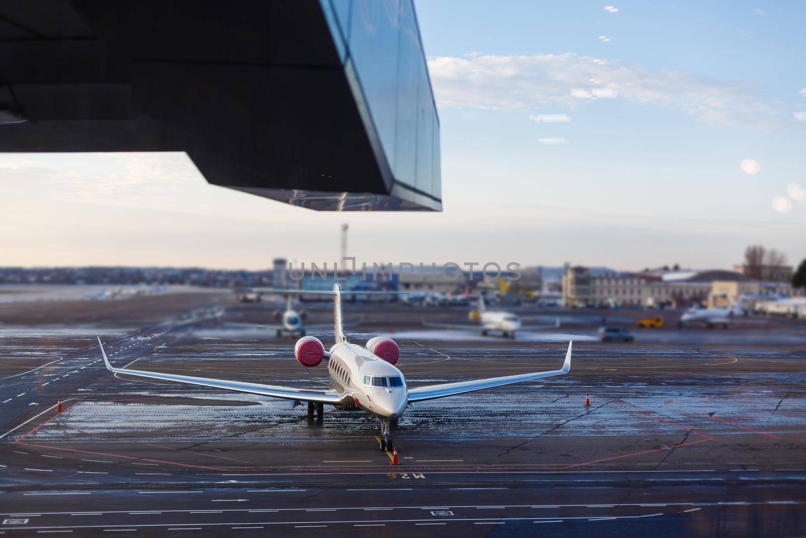 Commercial airplane parking at the airport by Andelov13