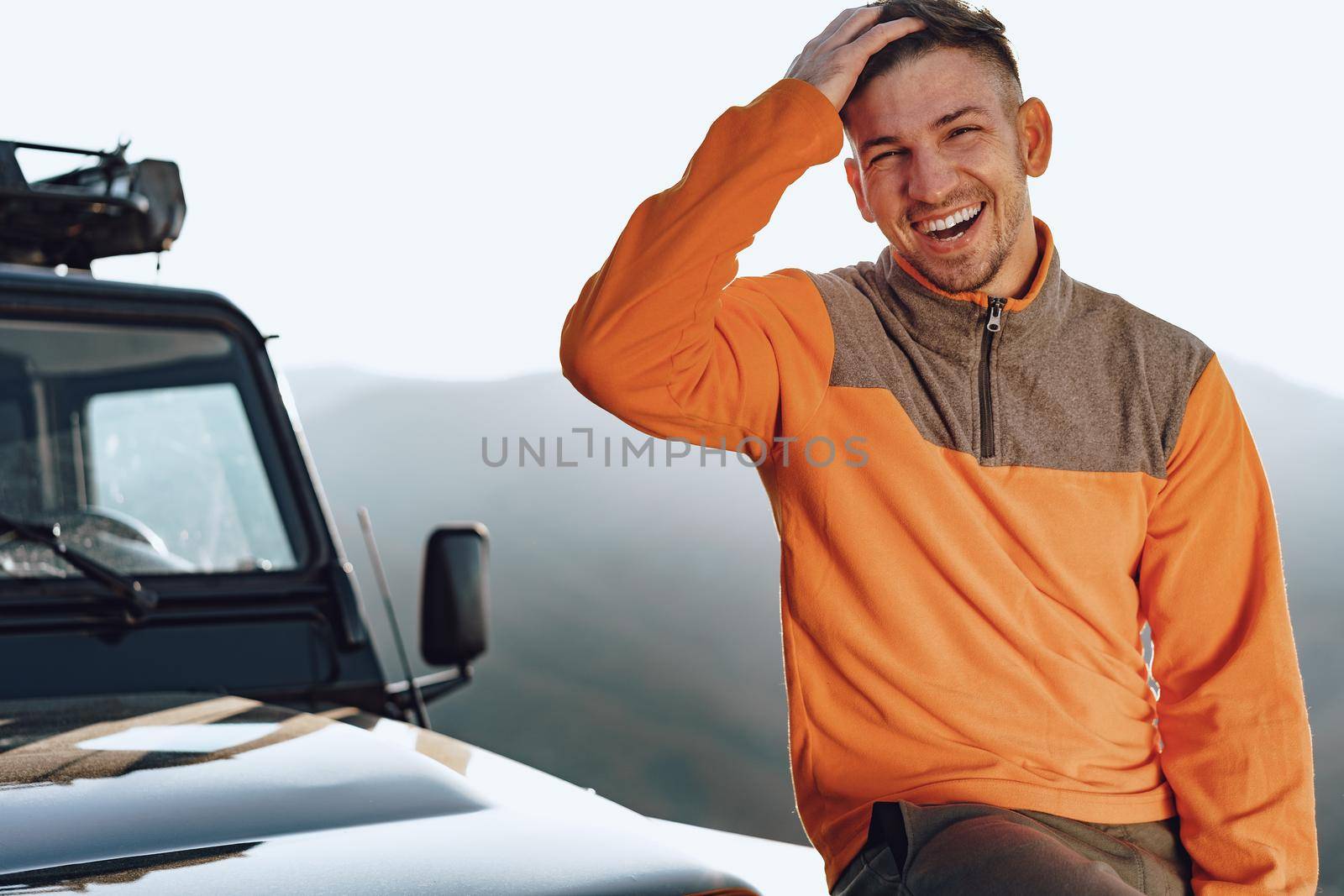 Portrait of a young caucasian man hiking in the mountains close up