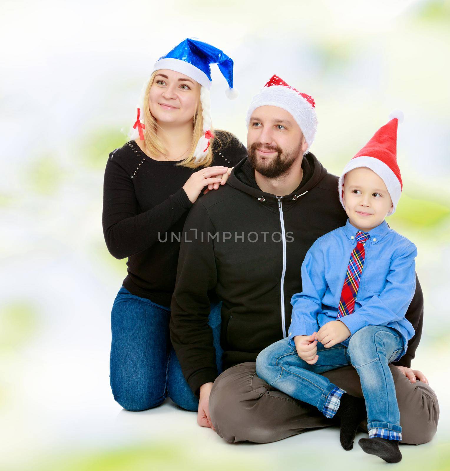 Happy family by the Christmas Tree by kolesnikov_studio
