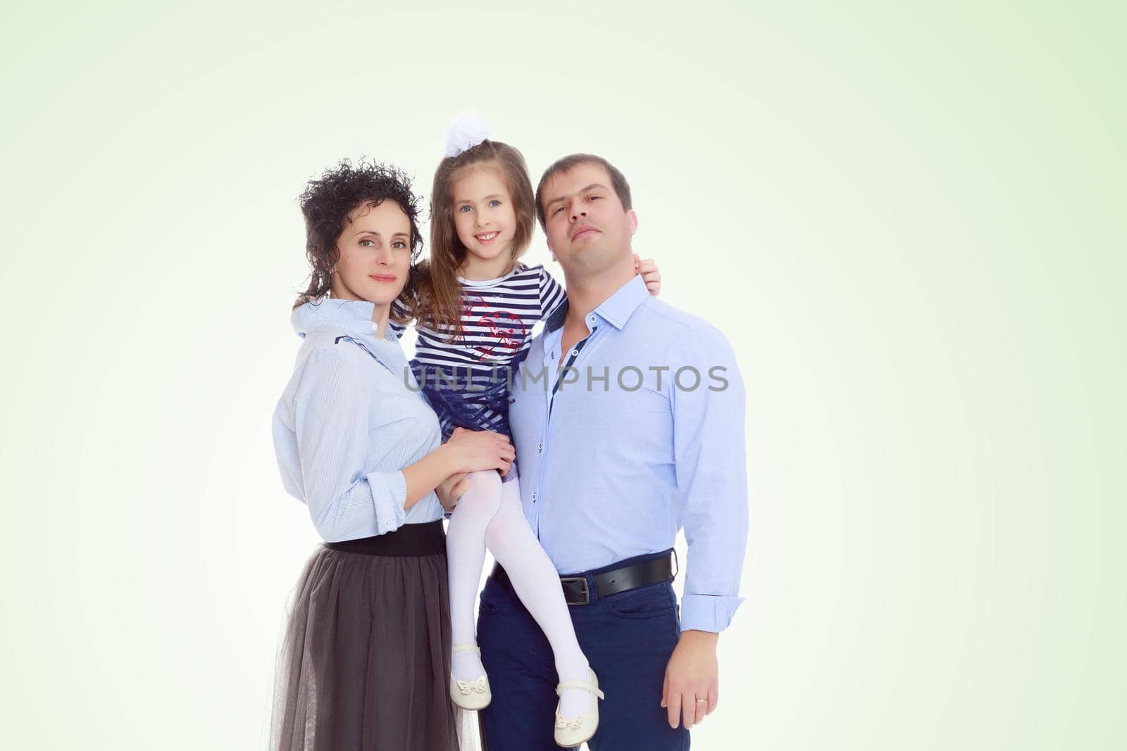 Happy parents with a small daughter. by kolesnikov_studio