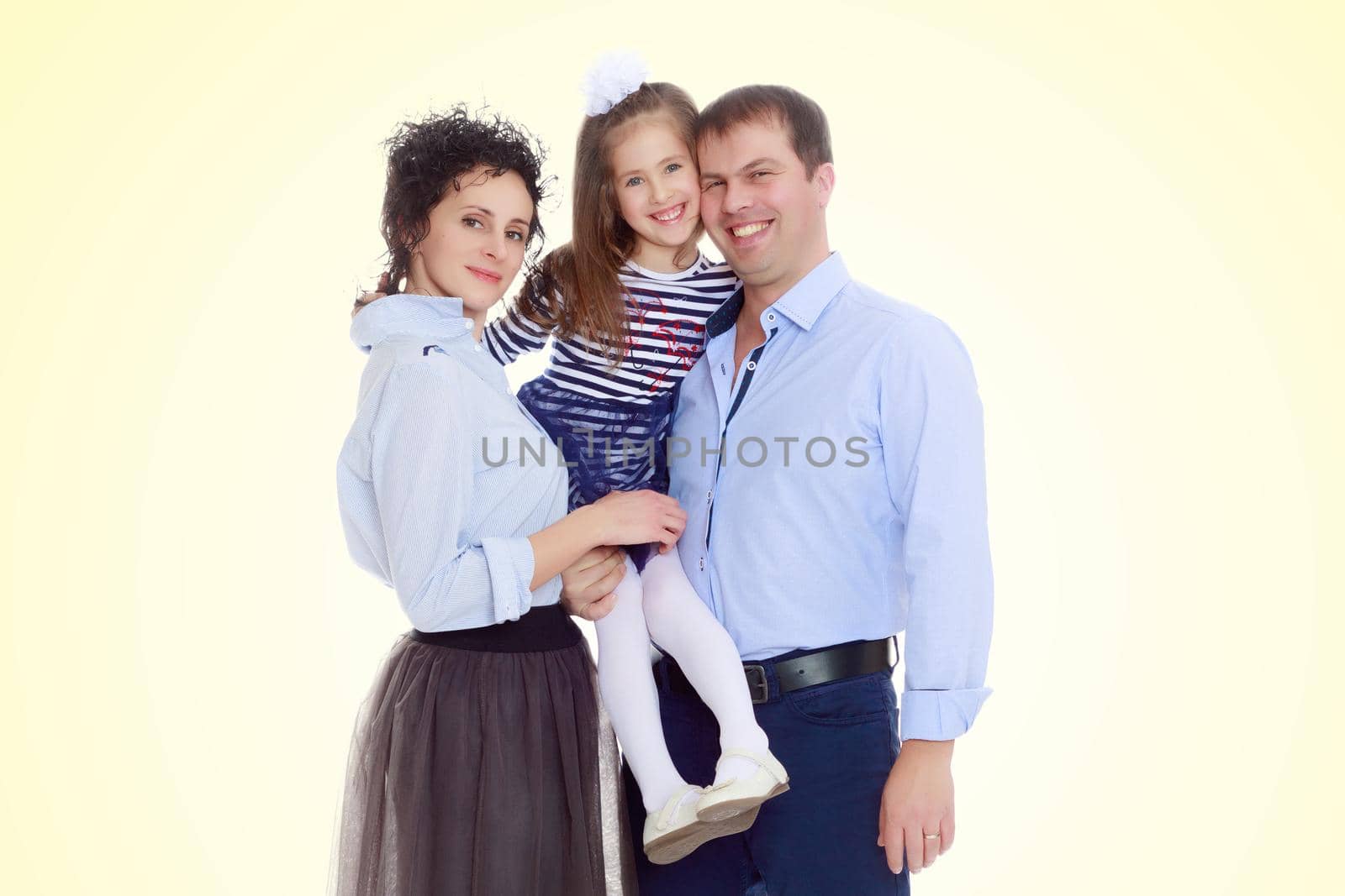 Happy parents with a small daughter. by kolesnikov_studio