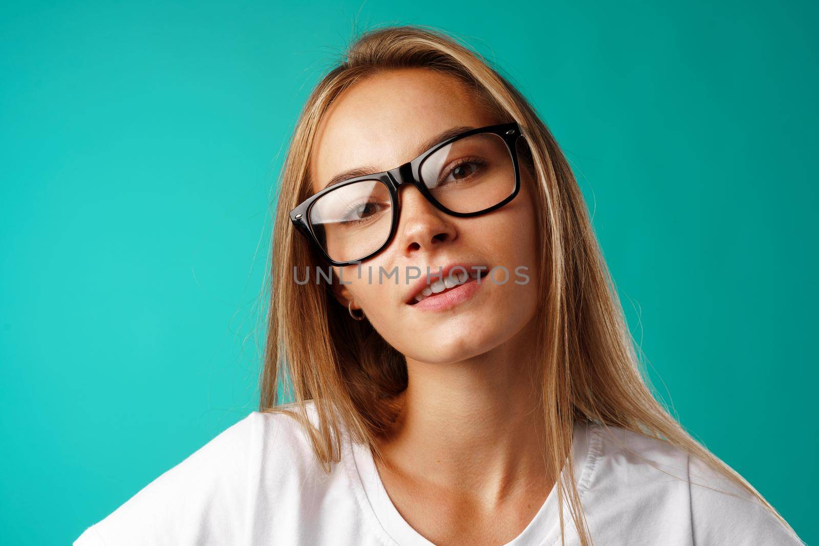 Portrait of a young beautiful happy caucasian woman smiling