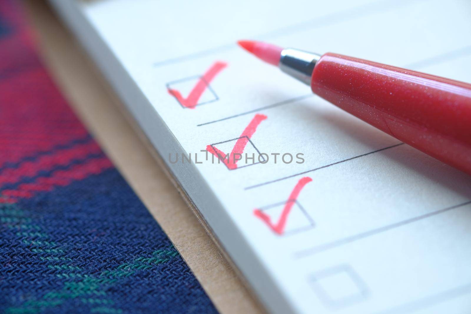 check mark on a check box on a paper .