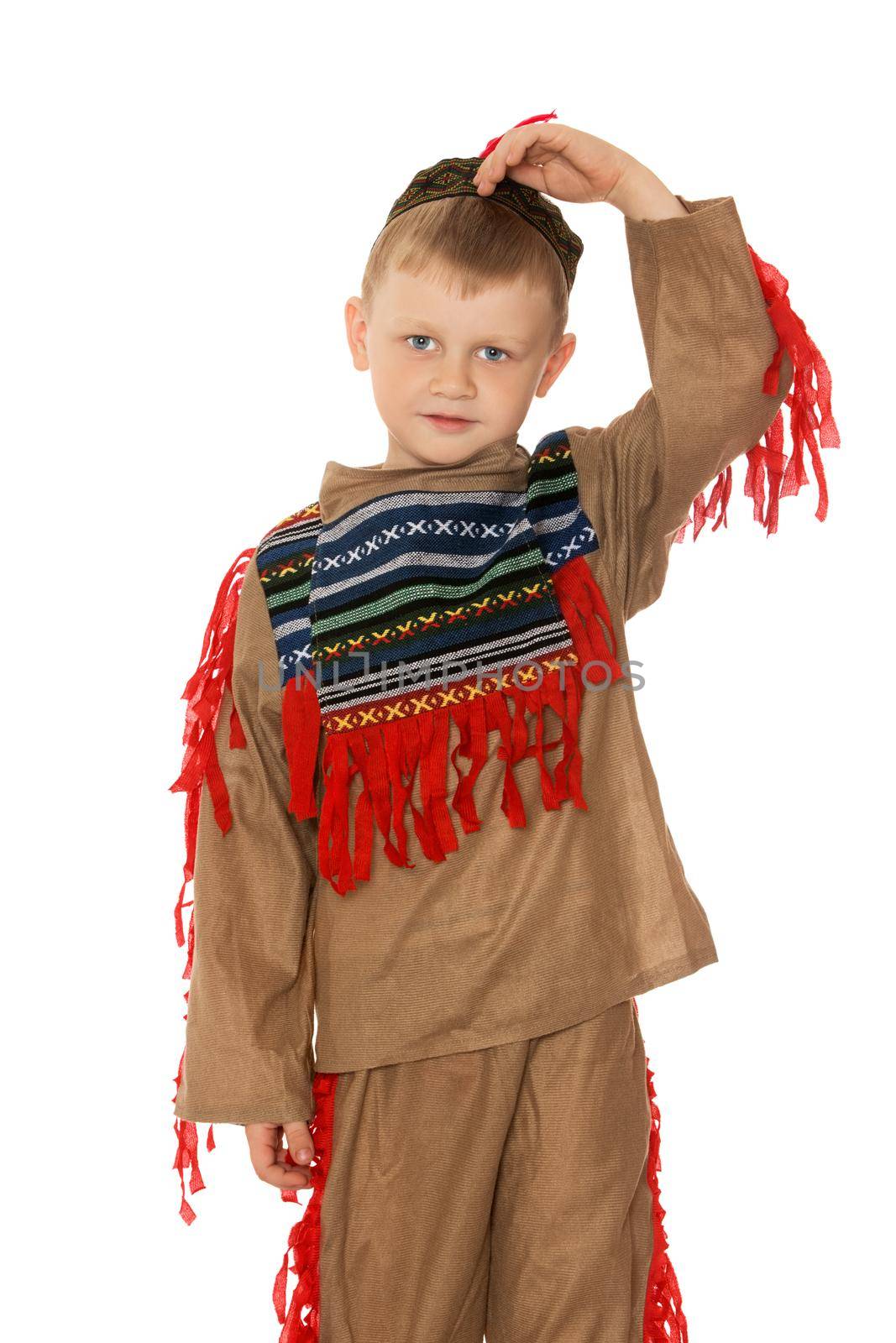 Cute little boy in costume of American Indian. Corrects hand hat on his head. Close-up - Isolated on white background