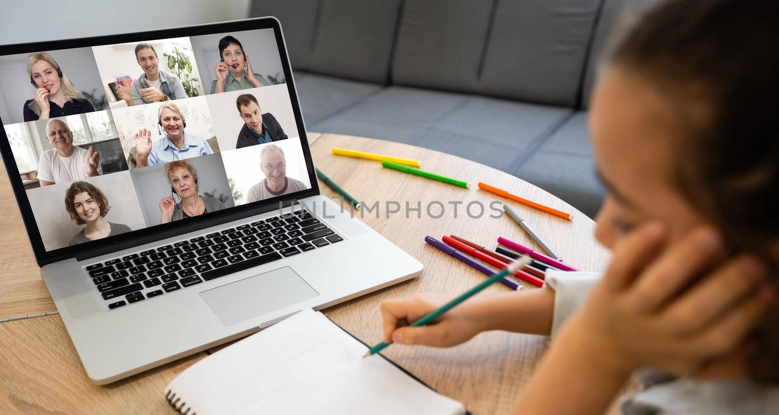 laptop with videoconference children classmates stands on the table by Andelov13