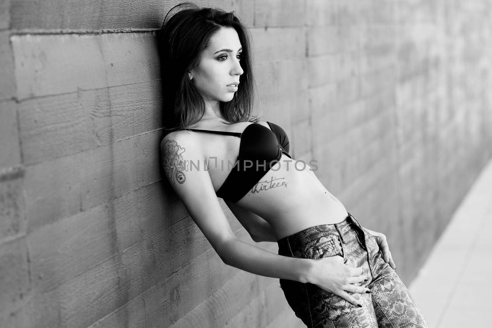 Woman wearing black bra and jeans by javiindy