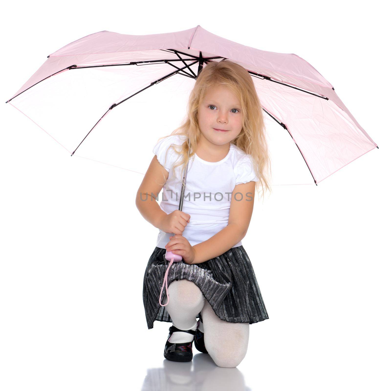 A nice little girl hid under an umbrella. The concept of a happy childhood, outdoor recreation, protection from bad weather. Isolated on white background.