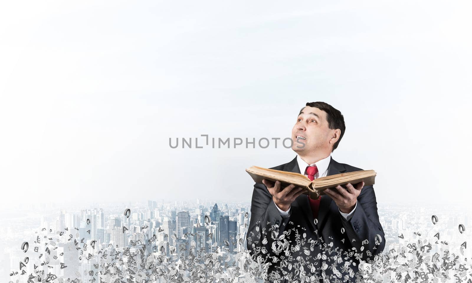 Happy businessman holding open old book. Smiling man in suit standing on city background with flying around various letters. Bookkeeper holding accountant book. Business accounting and consulting