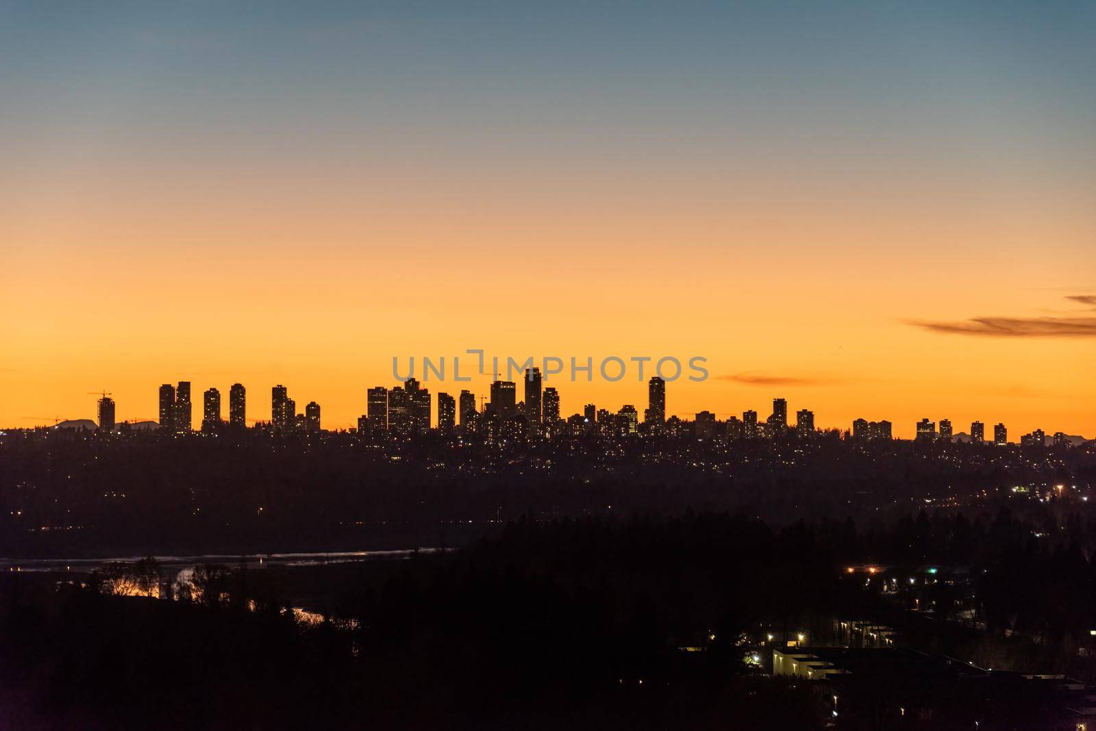 Cityscape on sunset with clear sky background closer to the night.