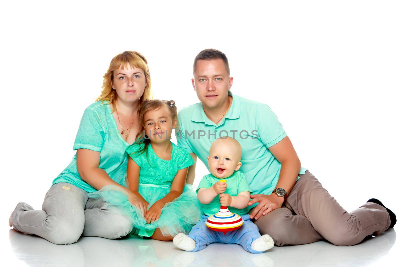 Happy family with young children. The concept of family happiness and development of children. Isolated on white background.