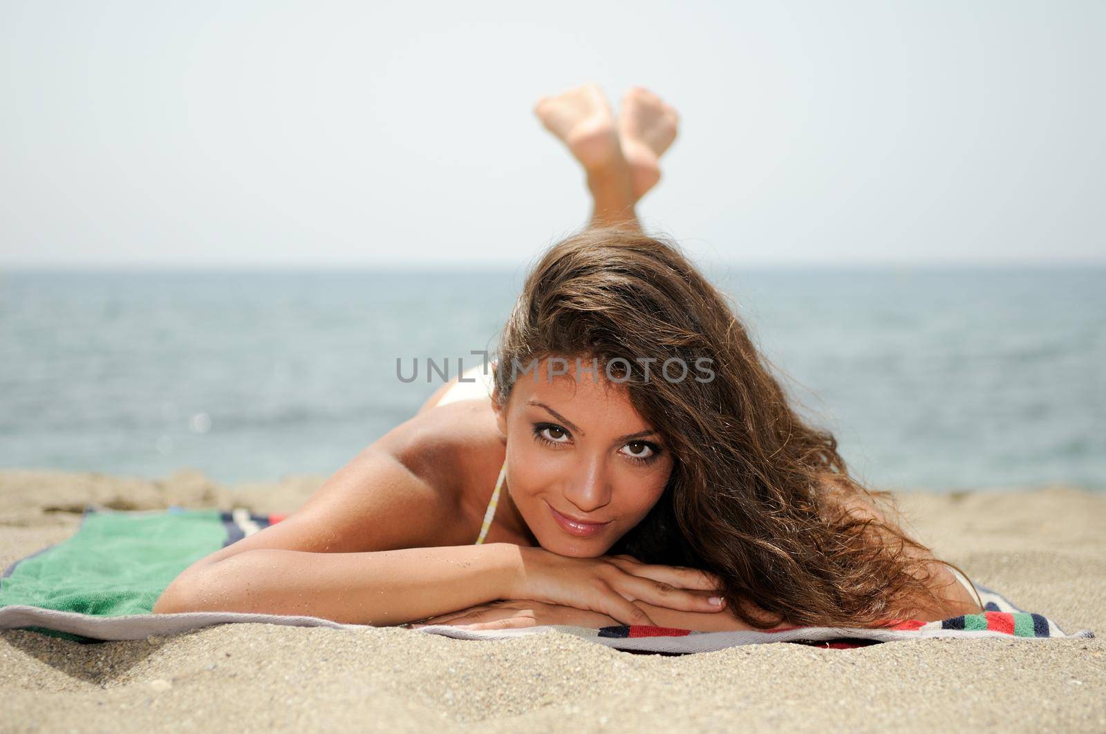 Portrait of a woman with beautiful body on a tropical beach