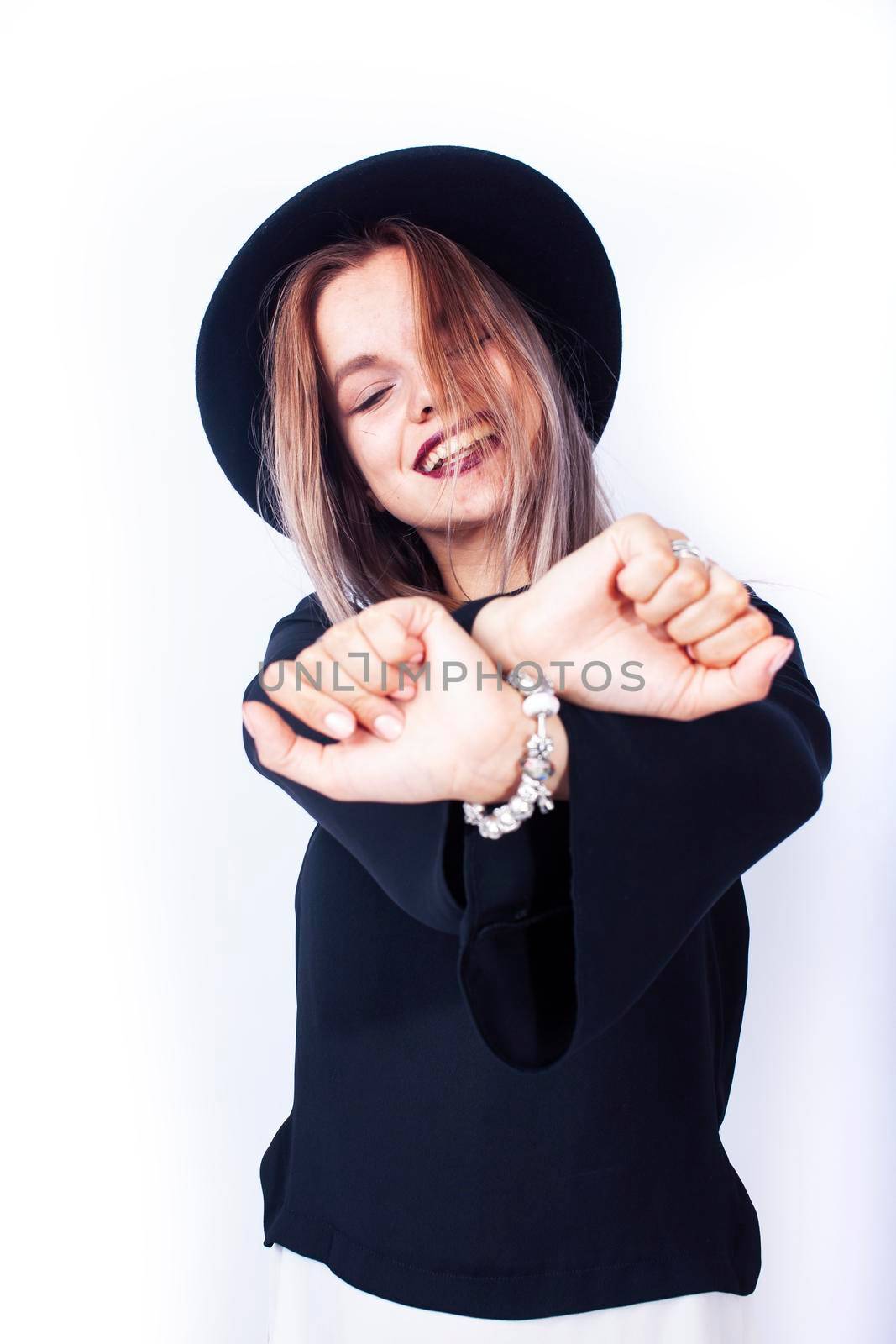 young pretty brunette girl hipster in hat on white background casual close up emotional posing smiling, lifestyle people concept