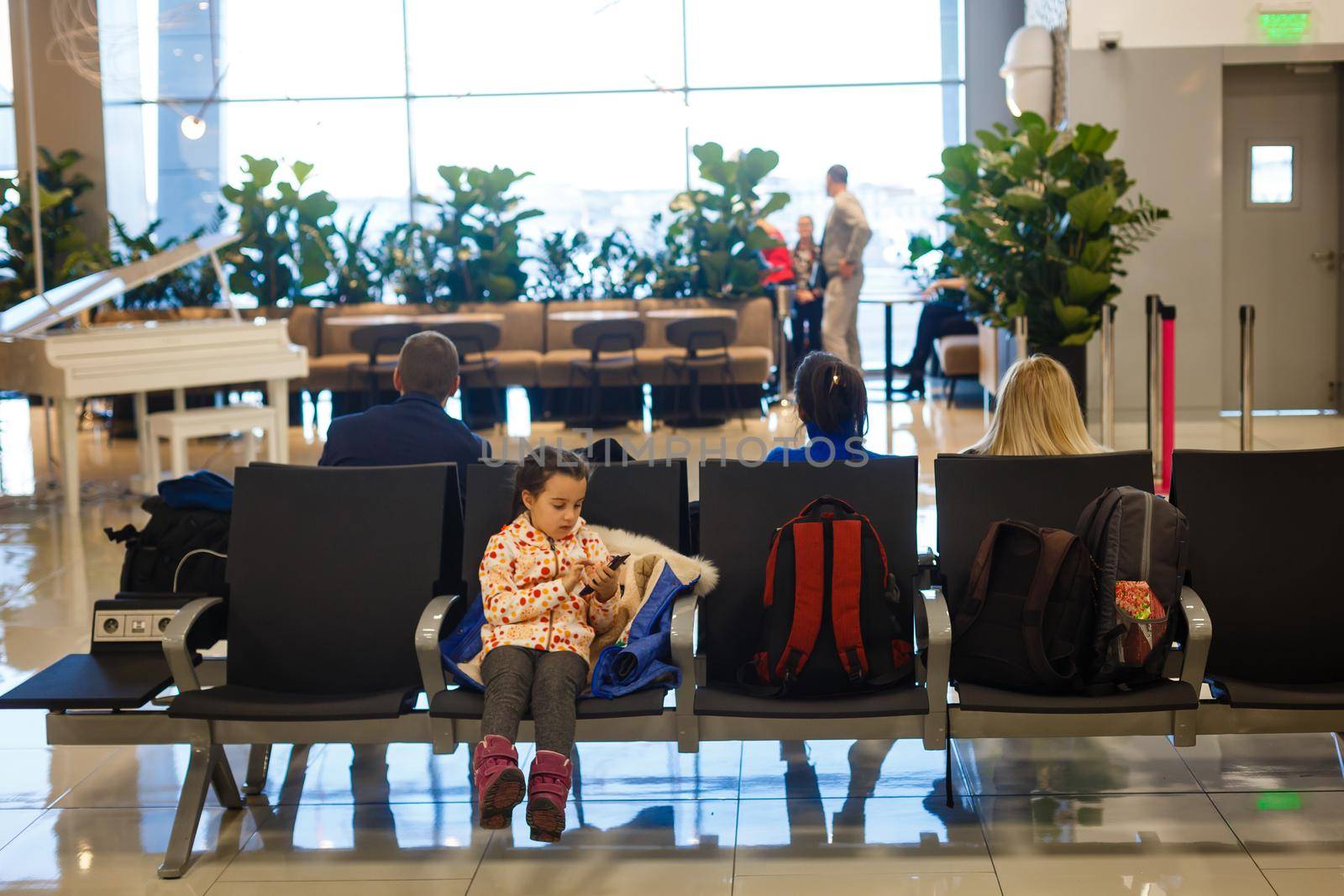 Adorable brunette little girl at airport