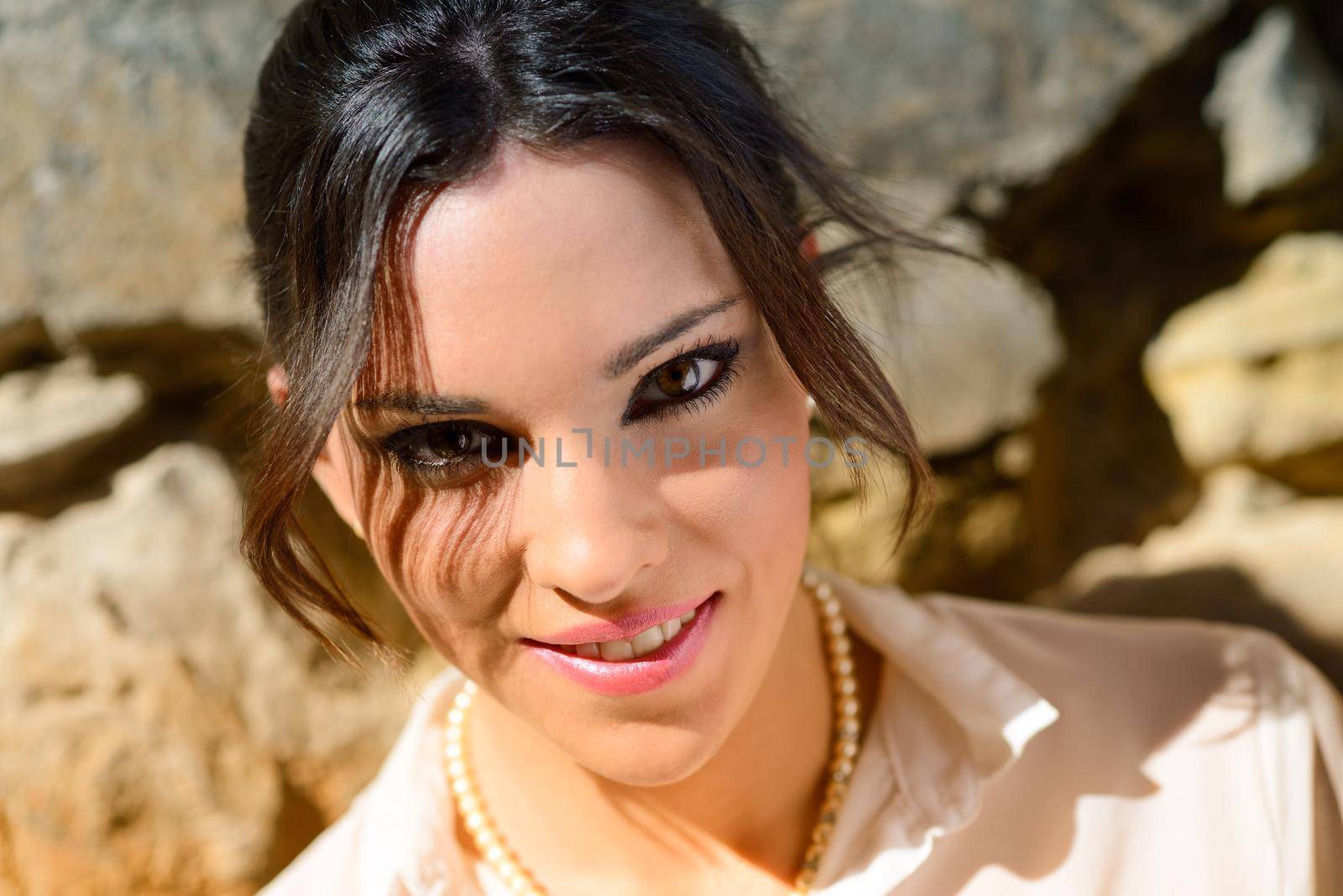 Portrait of a young beautiful woman in a urban background