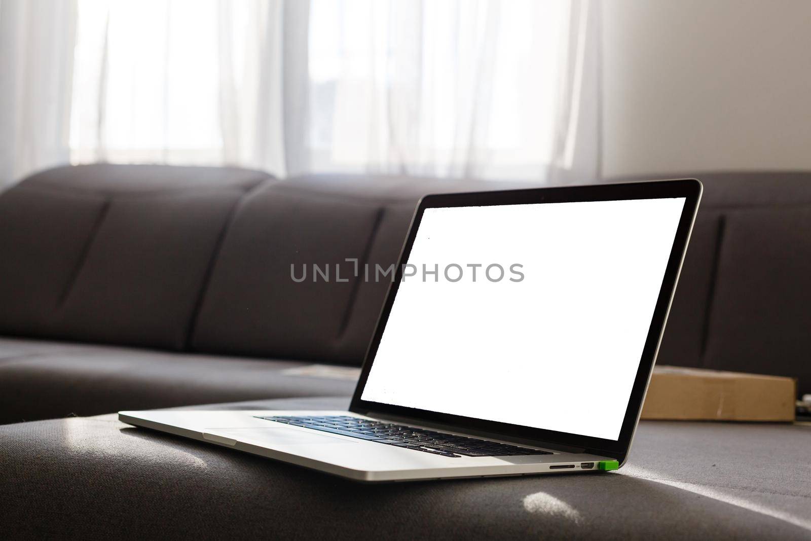 Laptop with blank screen on table
