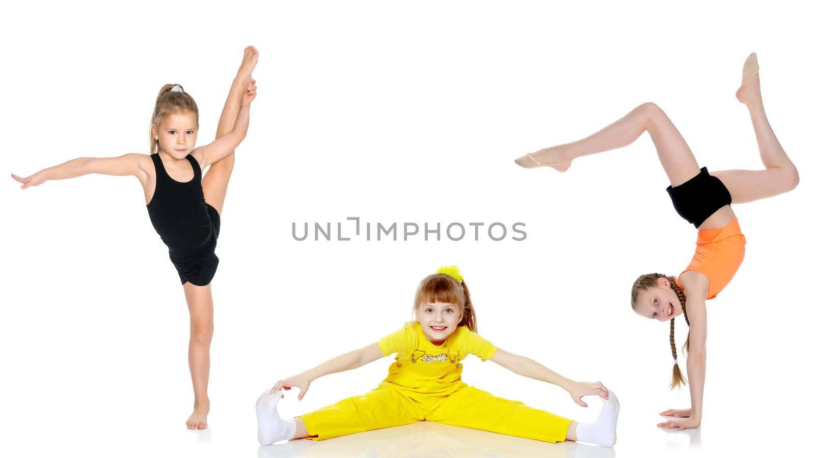 A group of cheerful little girls-gymnasts performing various gymnastic and fitness exercises. The concept of an active way of life, a happy childhood. Isolated on white background.
