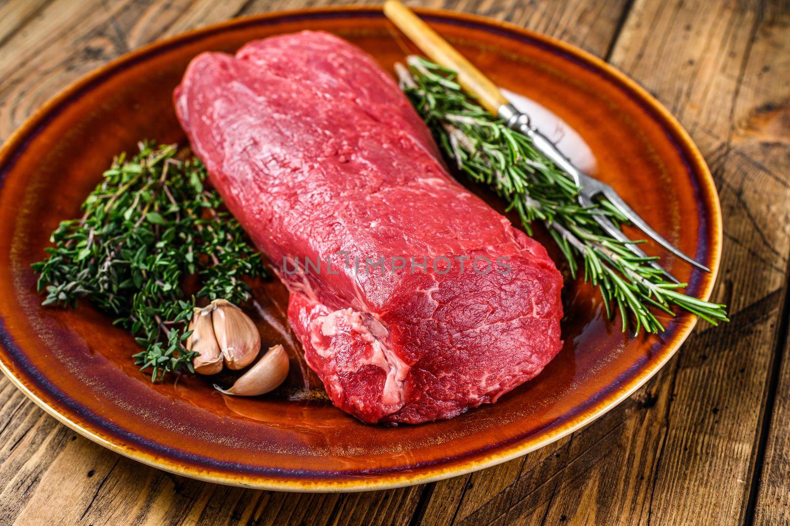 Whole Raw fillet Tenderloin beef veal meat for steaks. wooden background. Top view by Composter