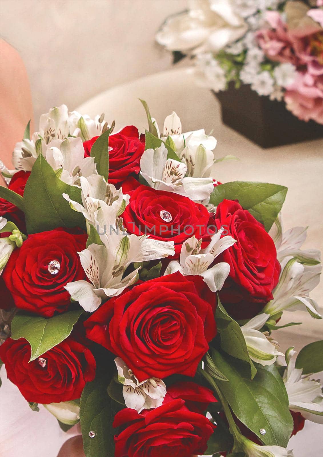 Wedding floral bouquet of the bride of red and white flowers of roses, close-up.