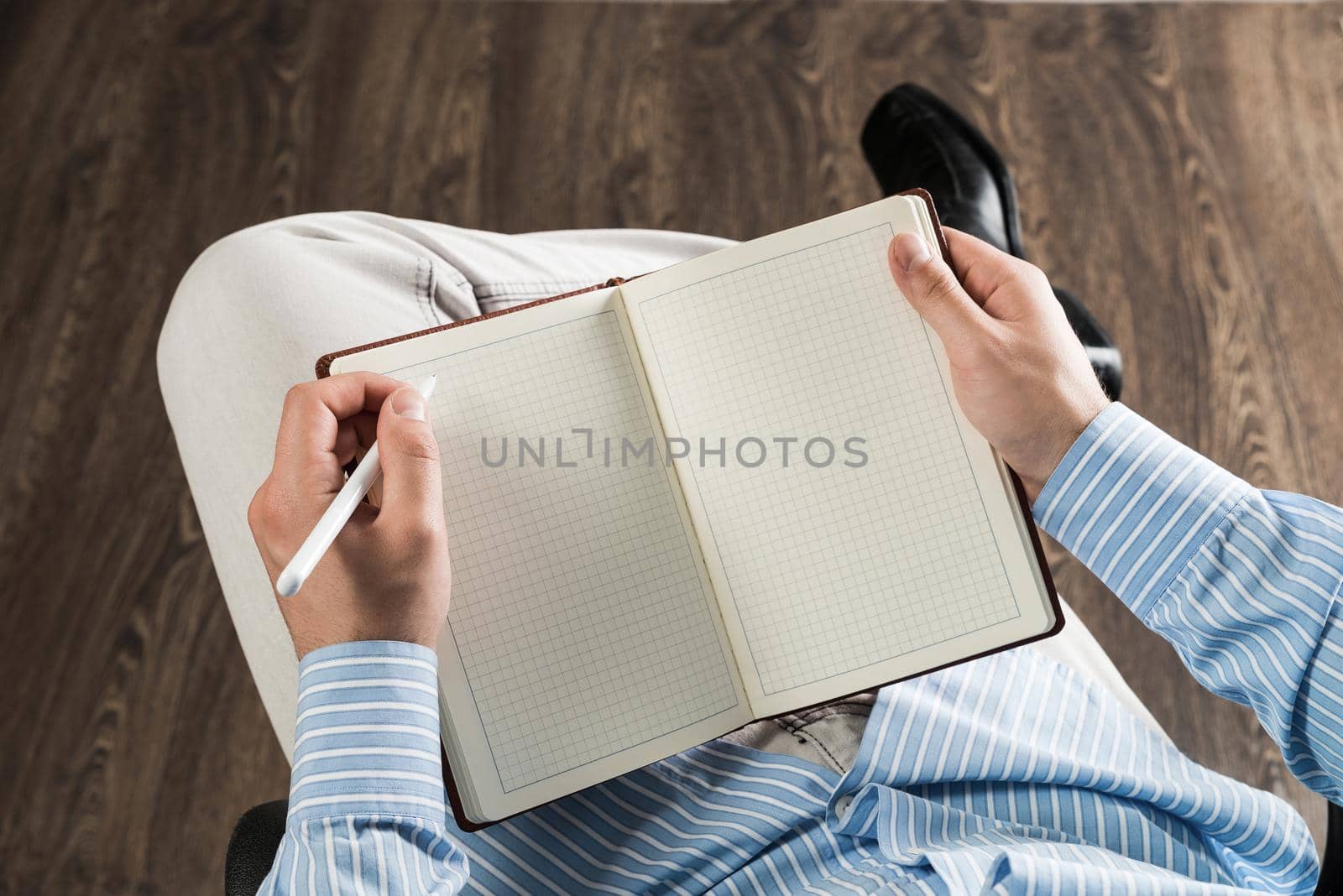 close-up of male hands with notepad, copy space