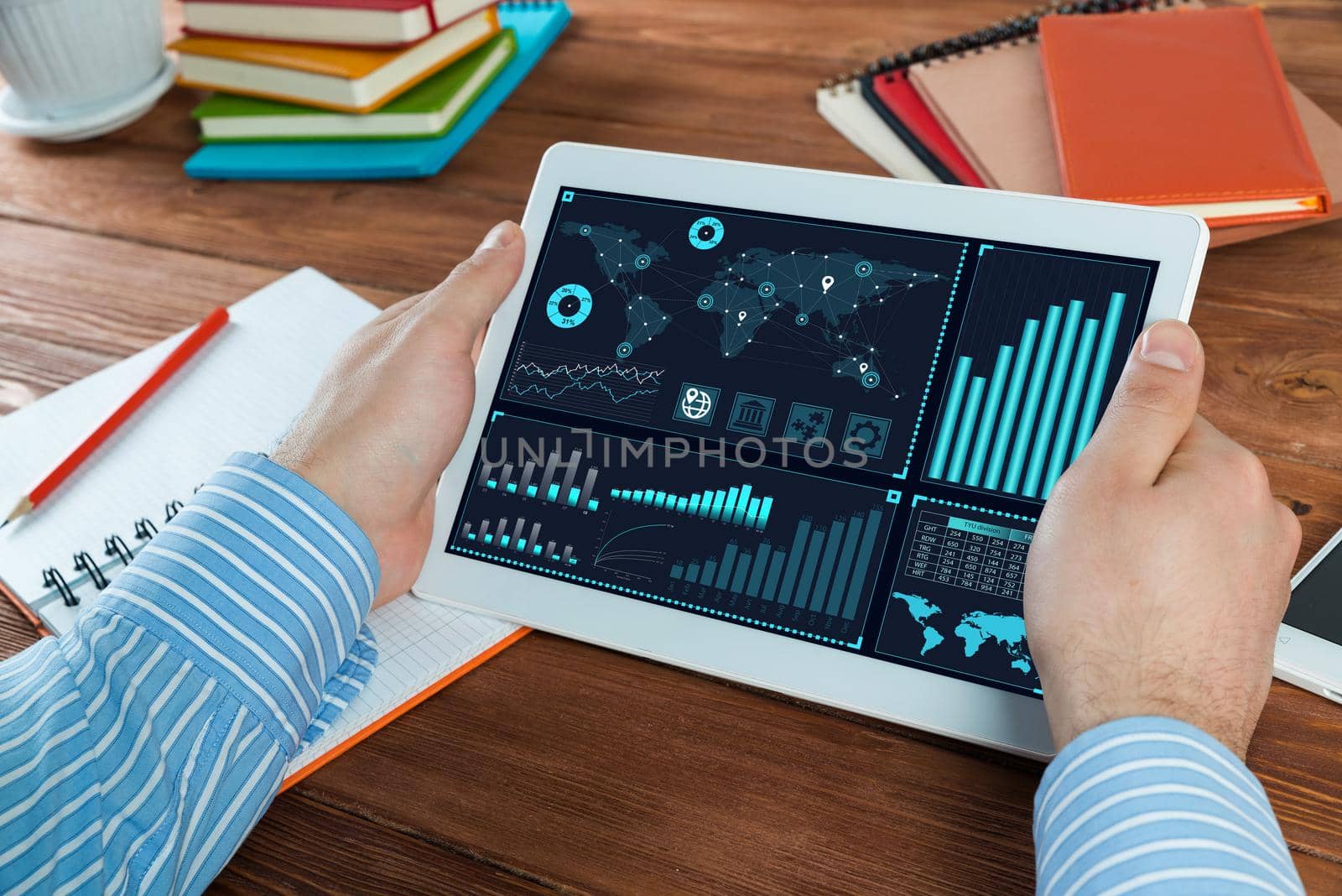 close-up, male hands with tablet. Businessman working at the table in office