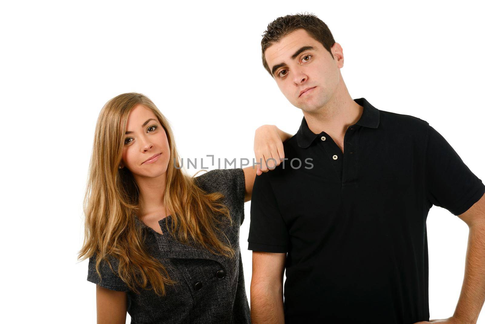 Portrait of a happy couple laughing at camera on white background