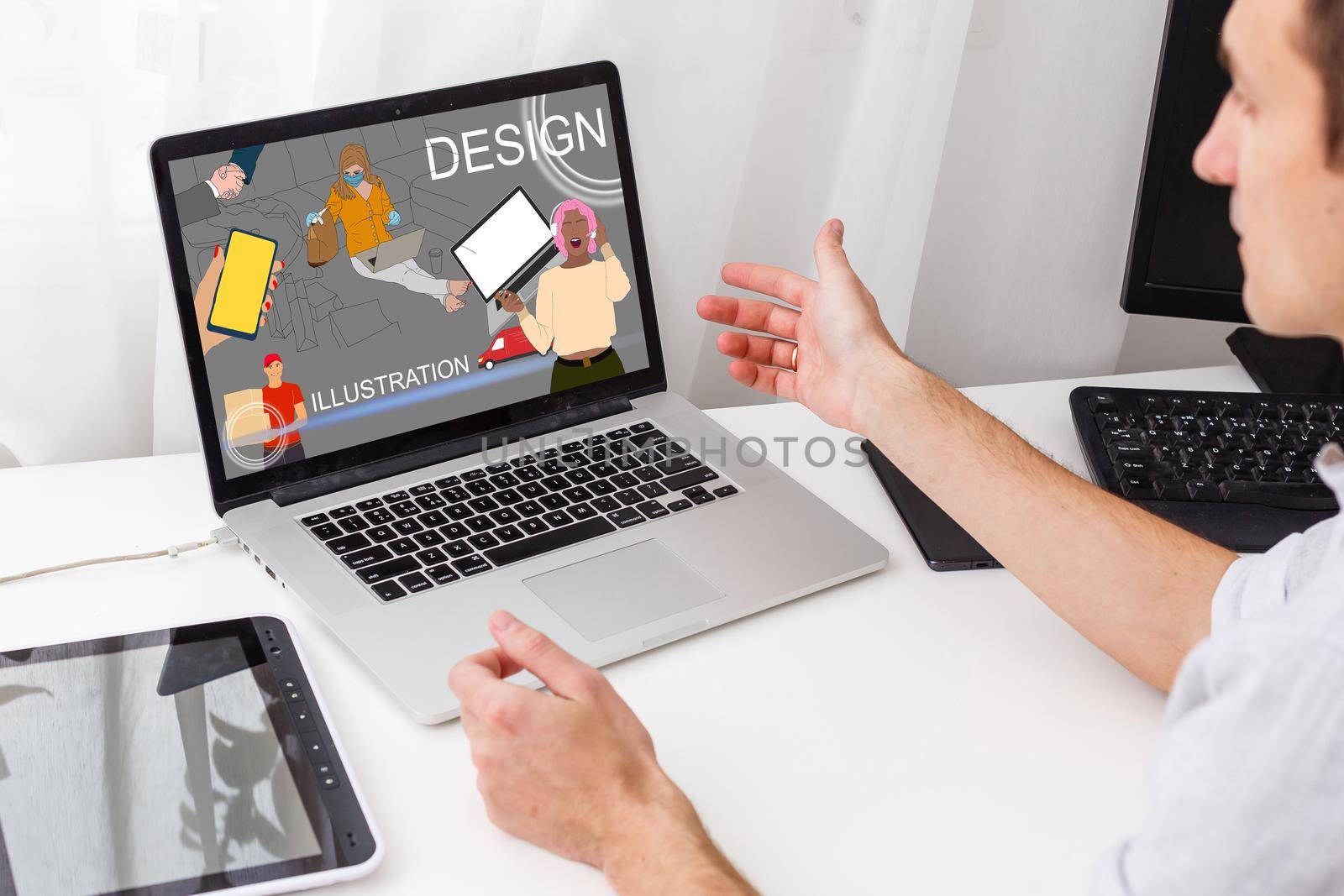 handsome hipster modern man designer working home using laptop at home by Andelov13