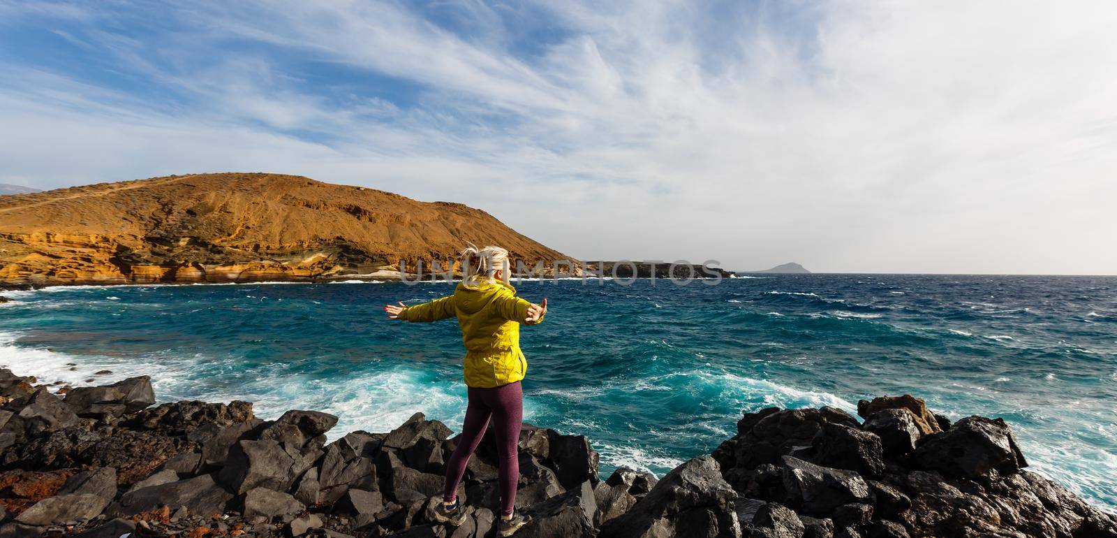 Traveler girl enjoying the beach in Tenerife