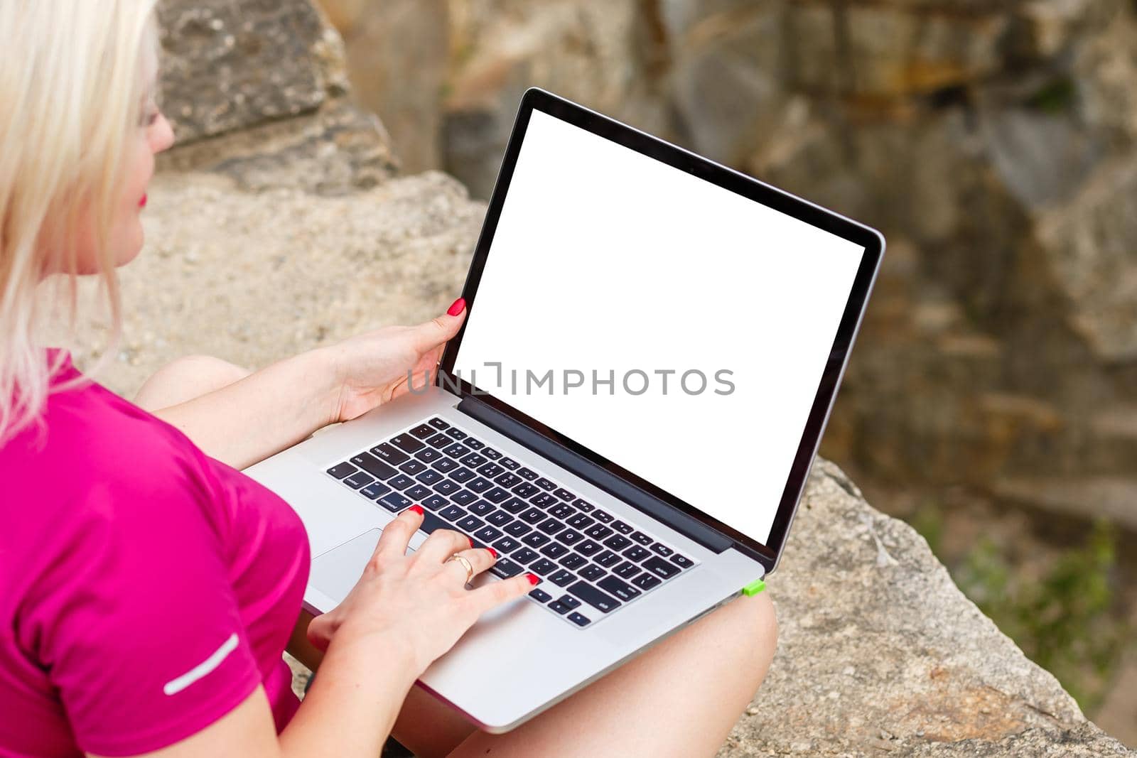 view of young successful female freelancer use laptop for distance work during her recreation time, woman's hands keyboarding on portable laptop computer with blank copy space on the screen
