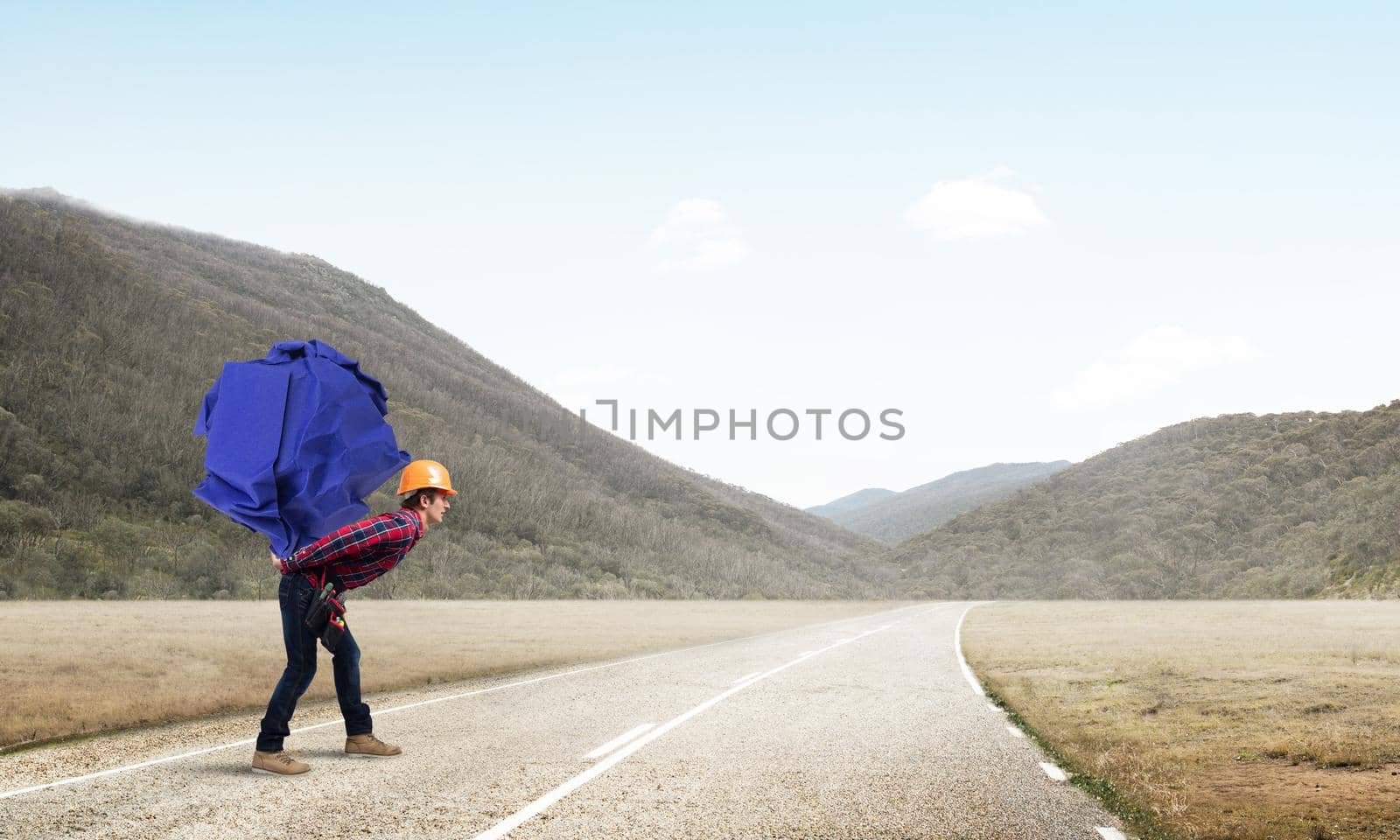 Builder man carrying paper ball on his back