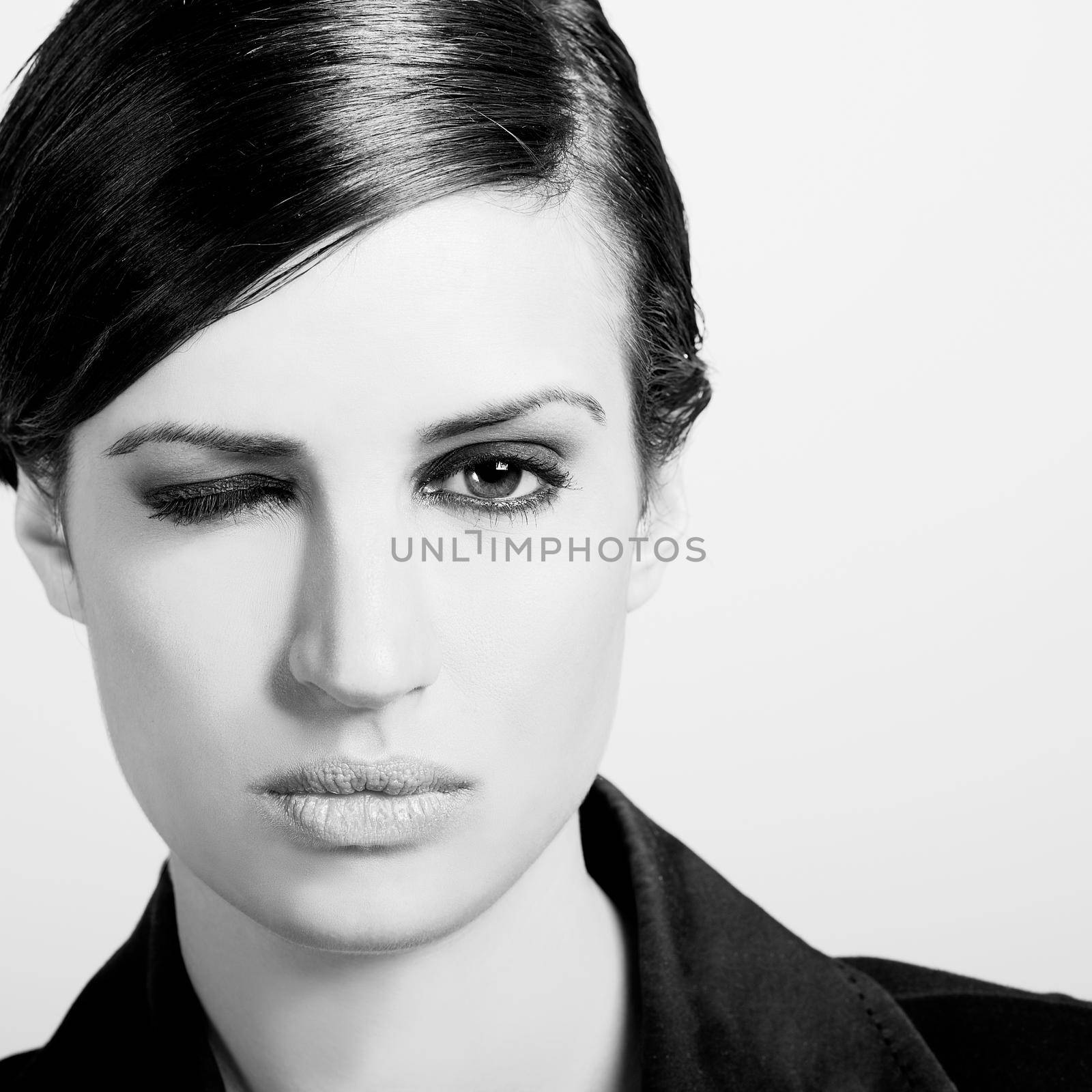 Woman with intense look on white background by javiindy