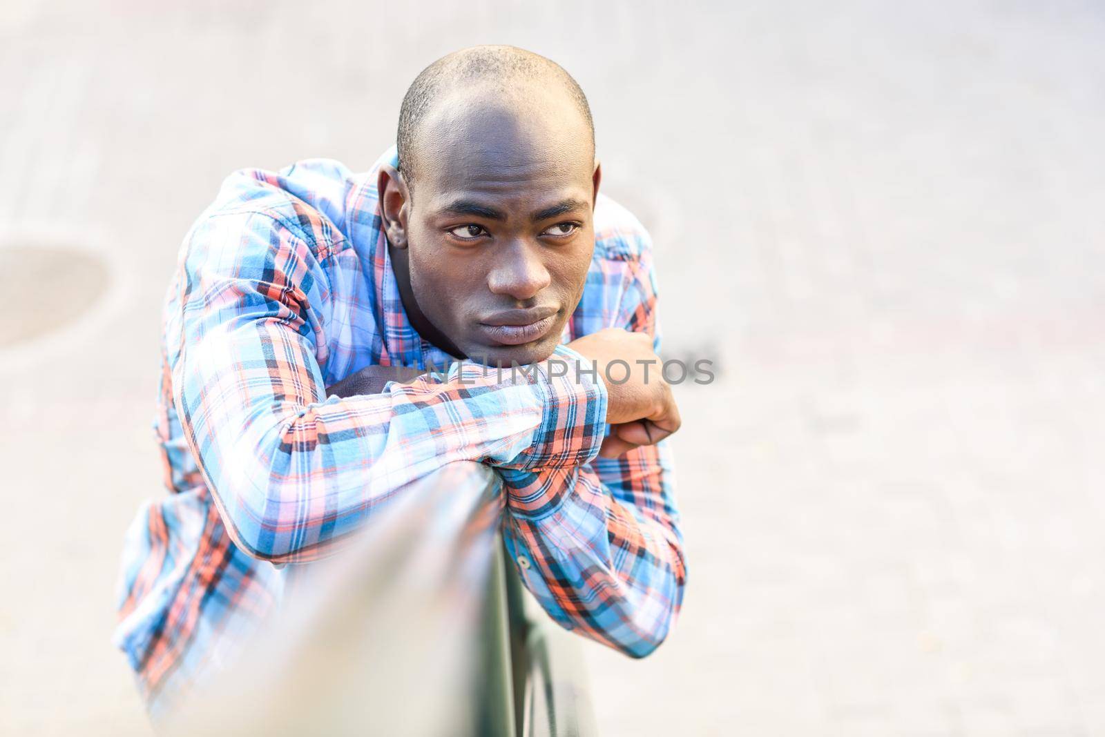 Portrait of black man wearing casual clothes in urban background