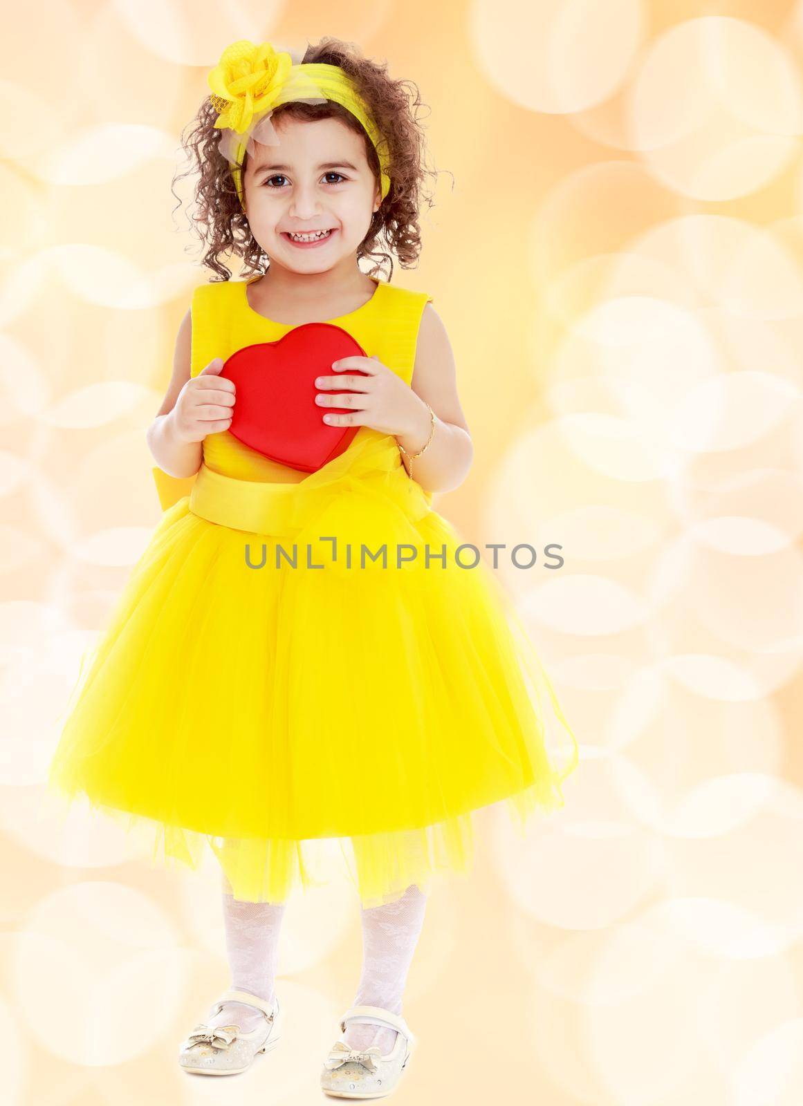 Cute little girl holds heart by kolesnikov_studio