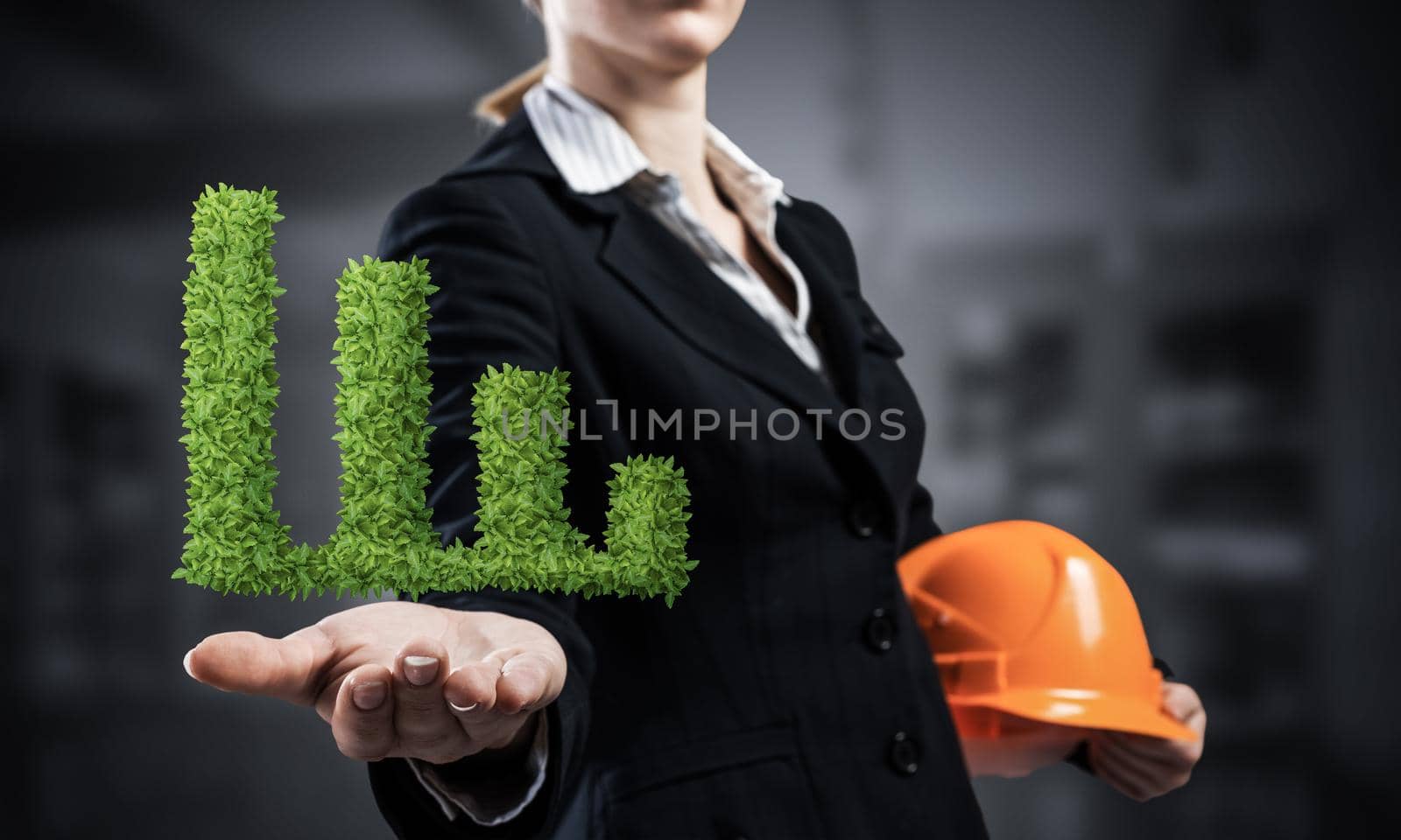 Businesswoman holds in palm green plant in shape of grow up chart. Woman engineer in business suit with orange safety helmet. Engineering and project management. Money saving and investing.