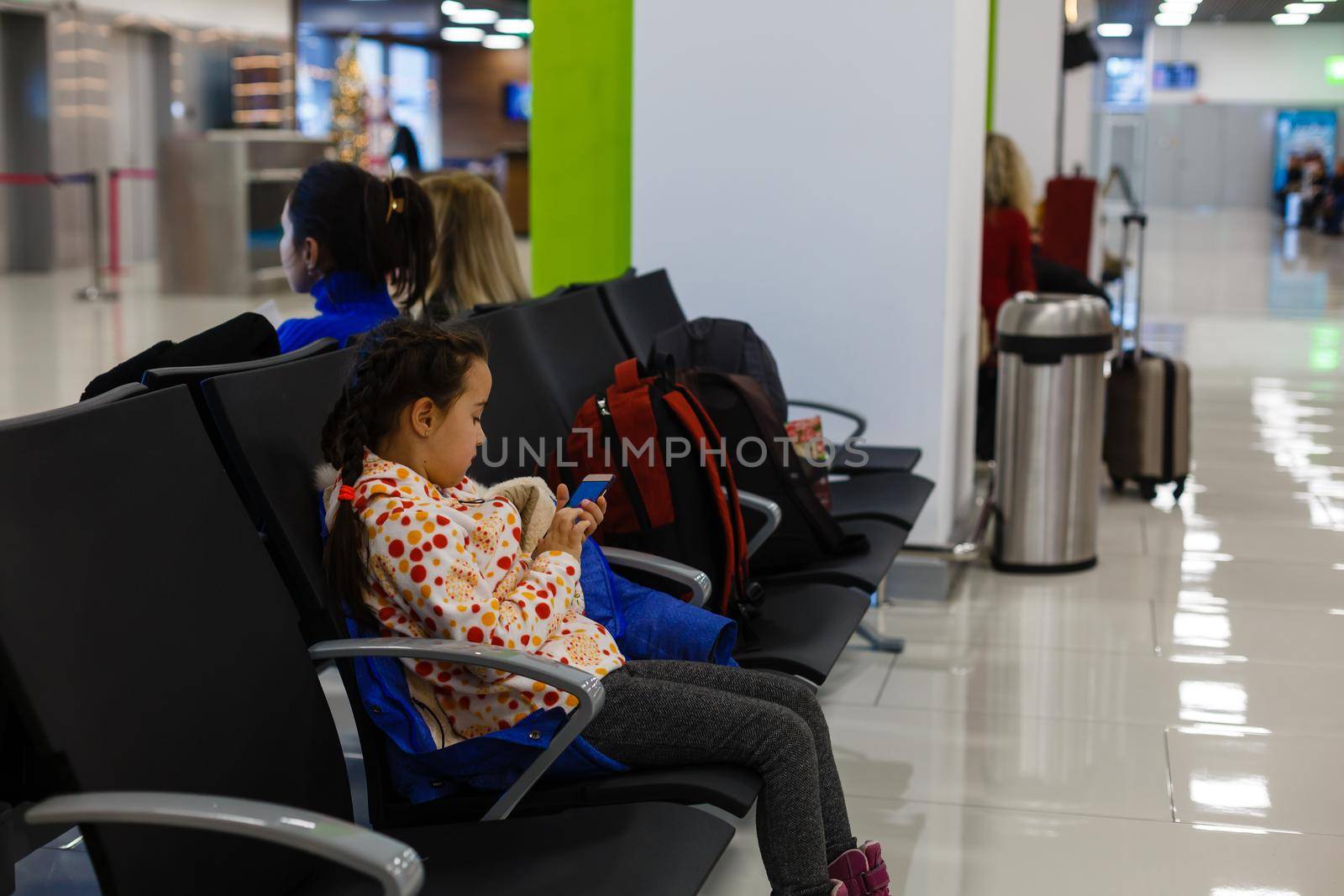 Adorable brunette little girl at airport