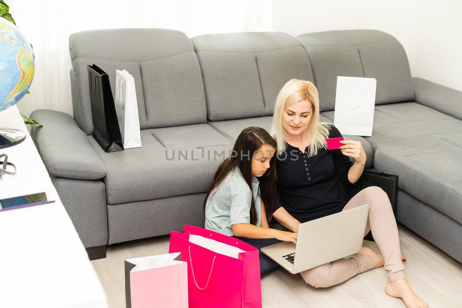 Mother and daughter shopping on internet by Andelov13