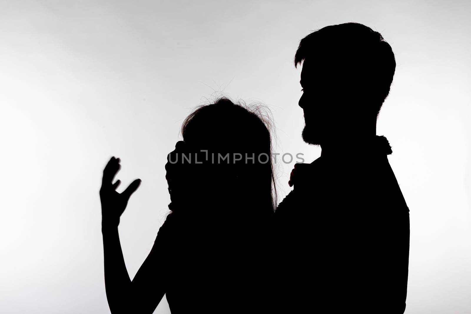 Domestic violence and abuse concept - Silhouette of man beating defenseless woman by Satura86