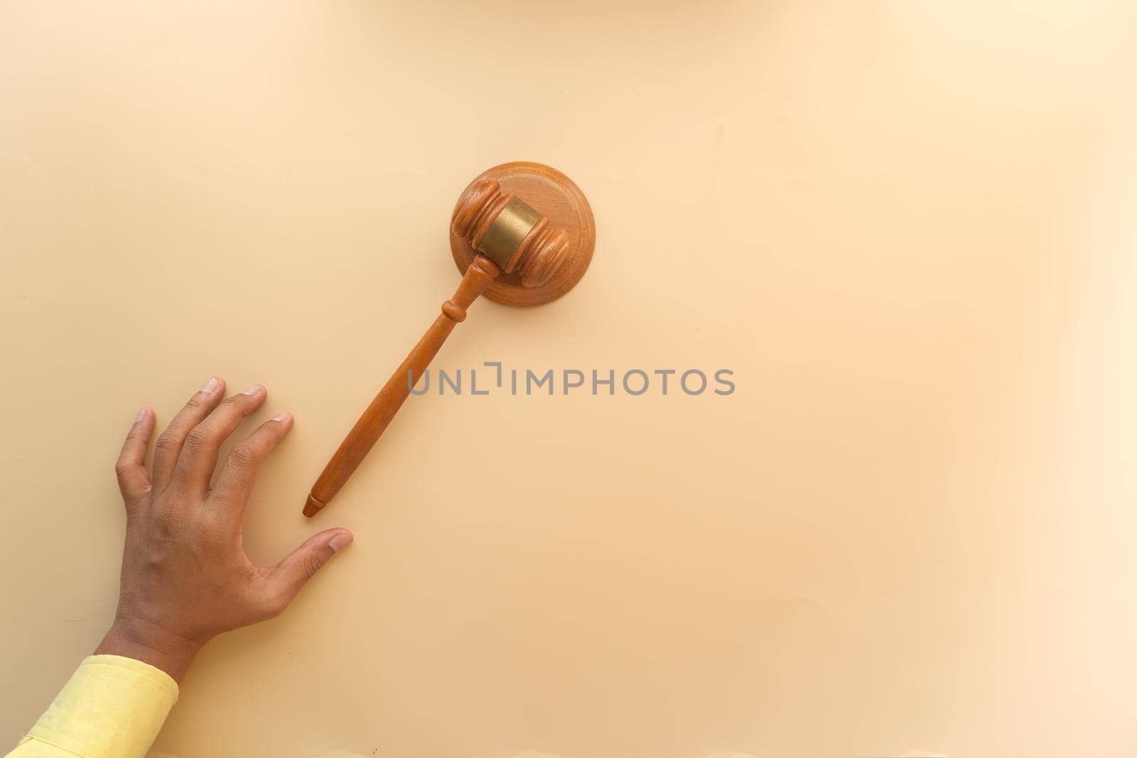 close up of person's hand striking the gavel