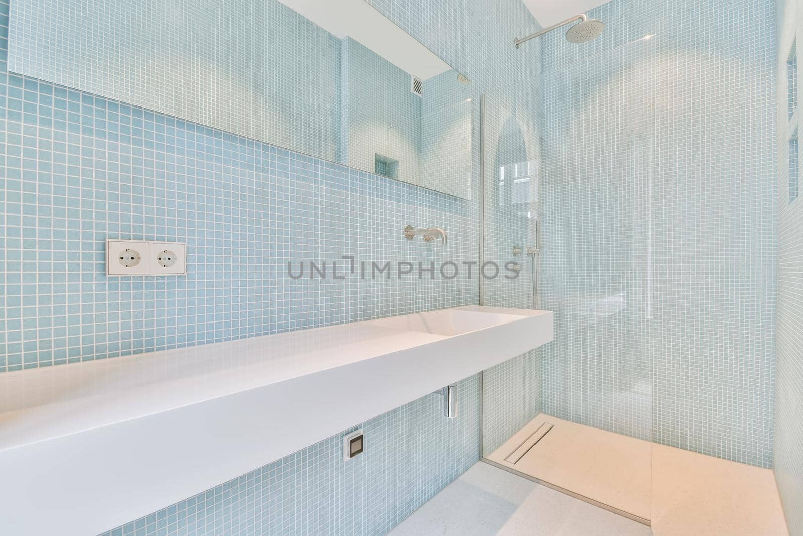 Bathroom with sink and shower by casamedia