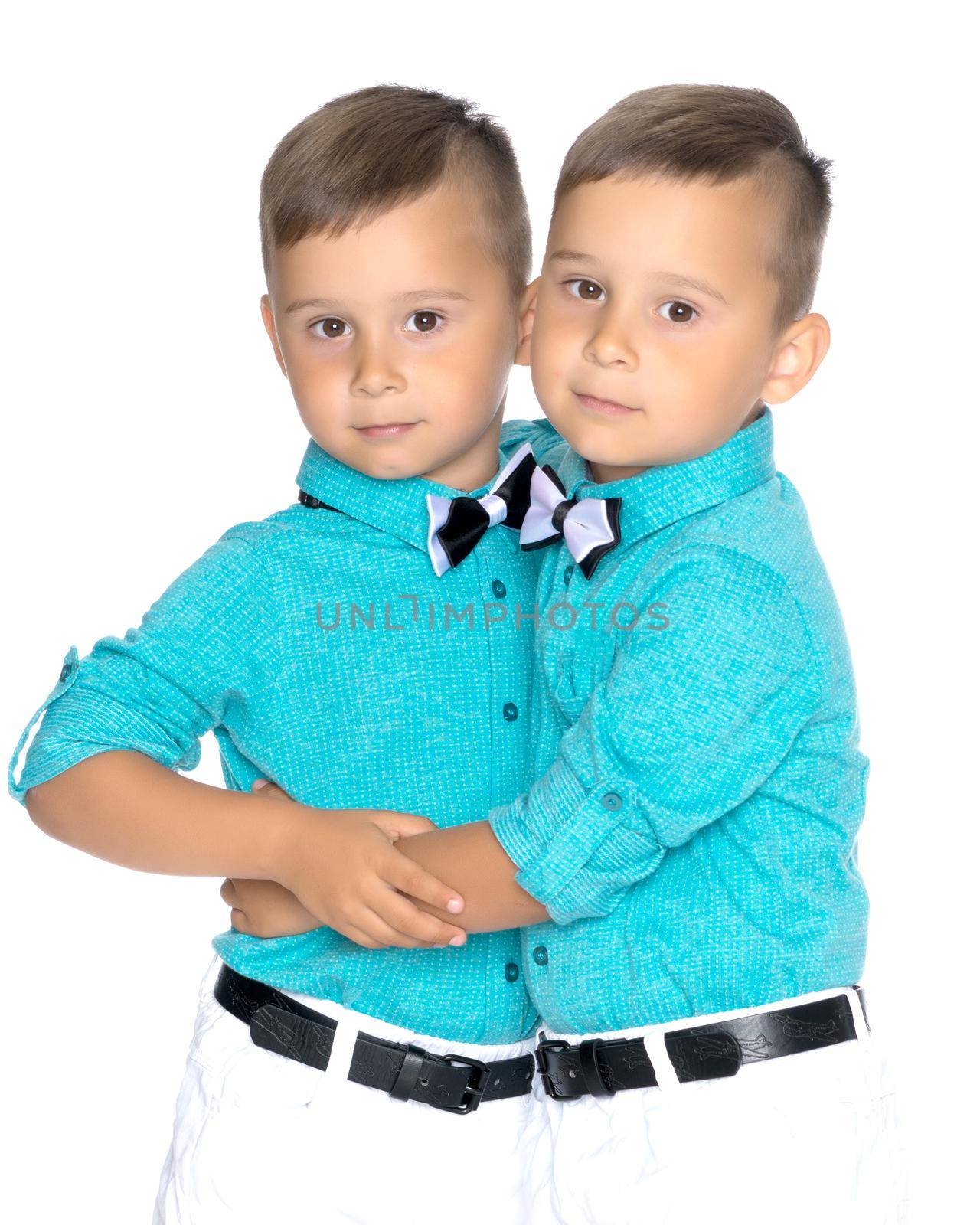 Two little brothers of Gemini together are sad. Isolated on white background