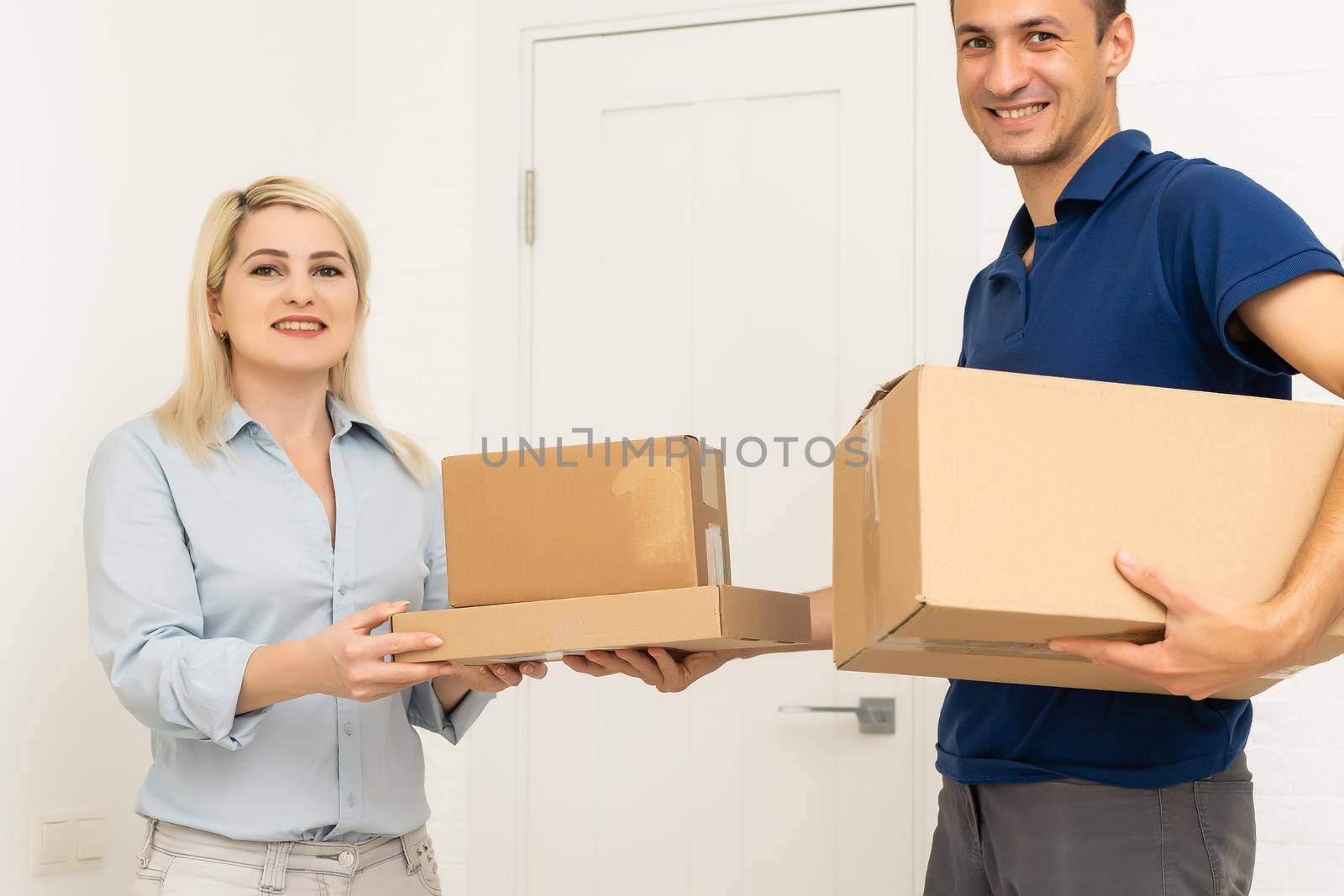 Delivery man holding cardboard boxes. Fast and free Delivery transport . Online shopping and Express delivery . Quarantine