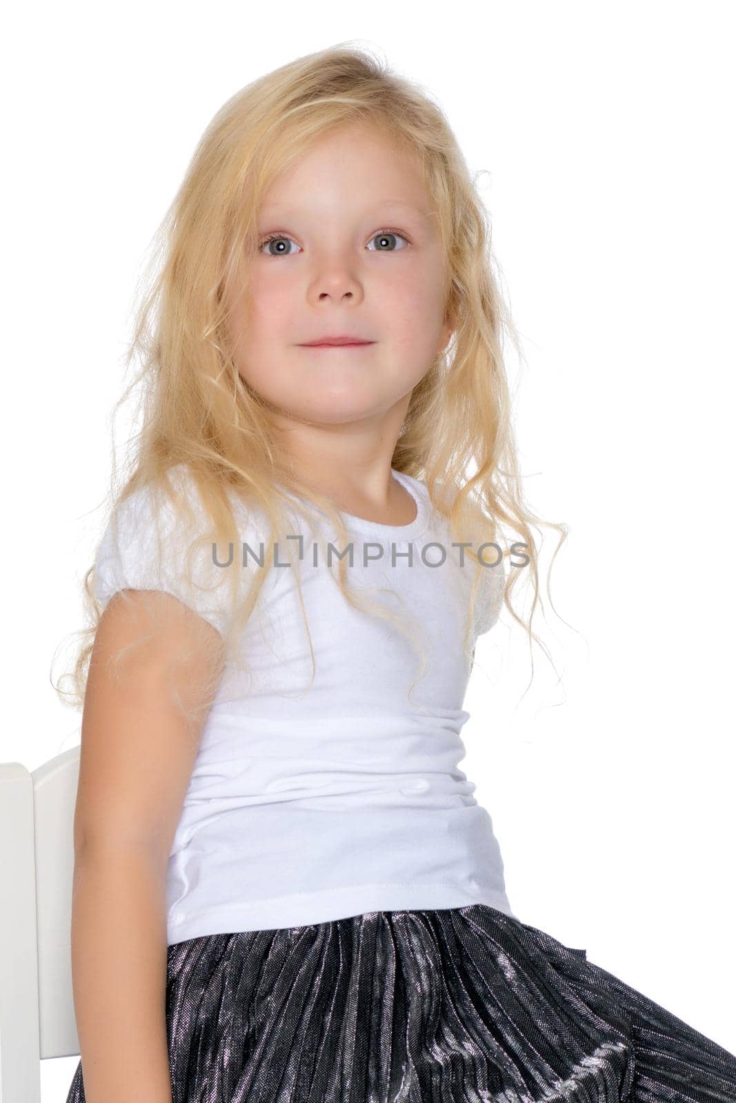 Beautiful little girl. The concept of a happy childhood, family well-being. Isolated on white background.