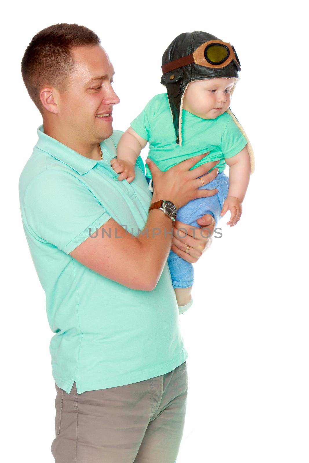 Dad holds the baby in his arms. The concept of educating the father of young children, Happy childhood, a friendly family. Isolated on white background.