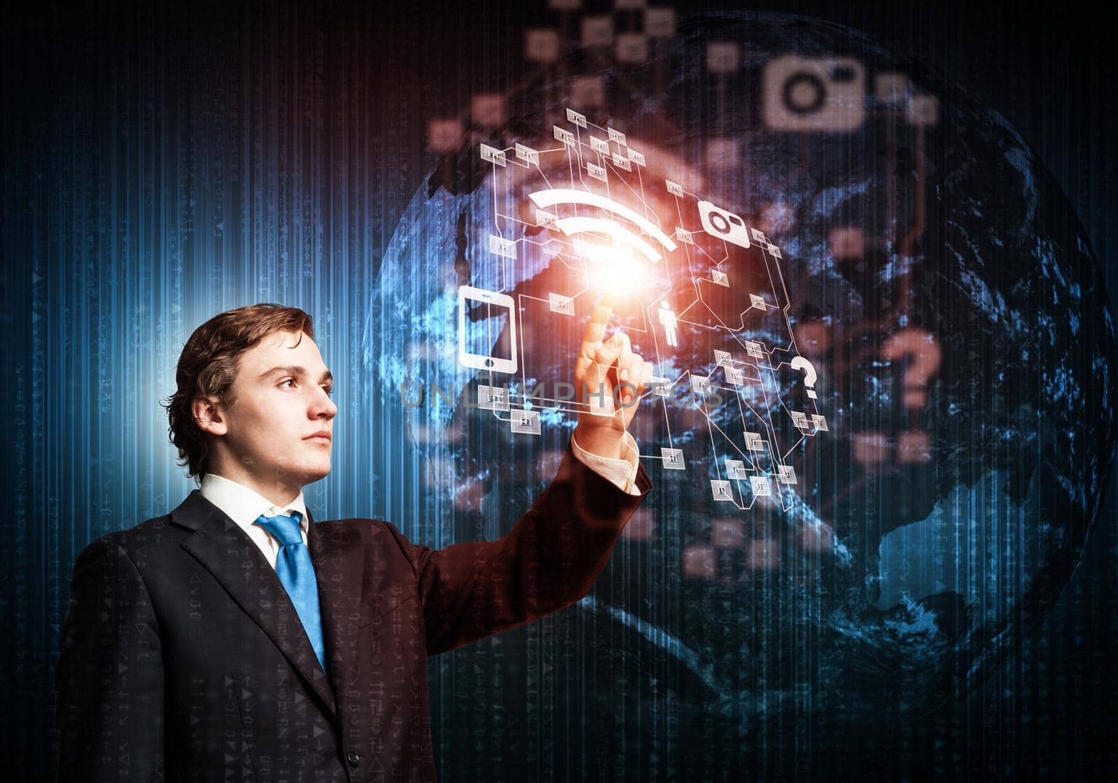 Handsome businessman in suit using virtual interface of computer application. Innovation technology in life and corporate business. Digital data visualization and modern cyberspace for work.
