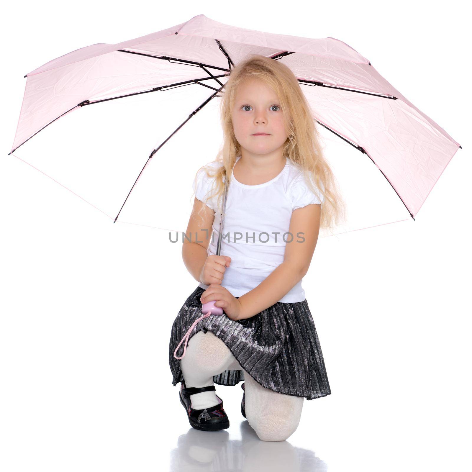 A nice little girl hid under an umbrella. The concept of a happy childhood, outdoor recreation, protection from bad weather. Isolated on white background.