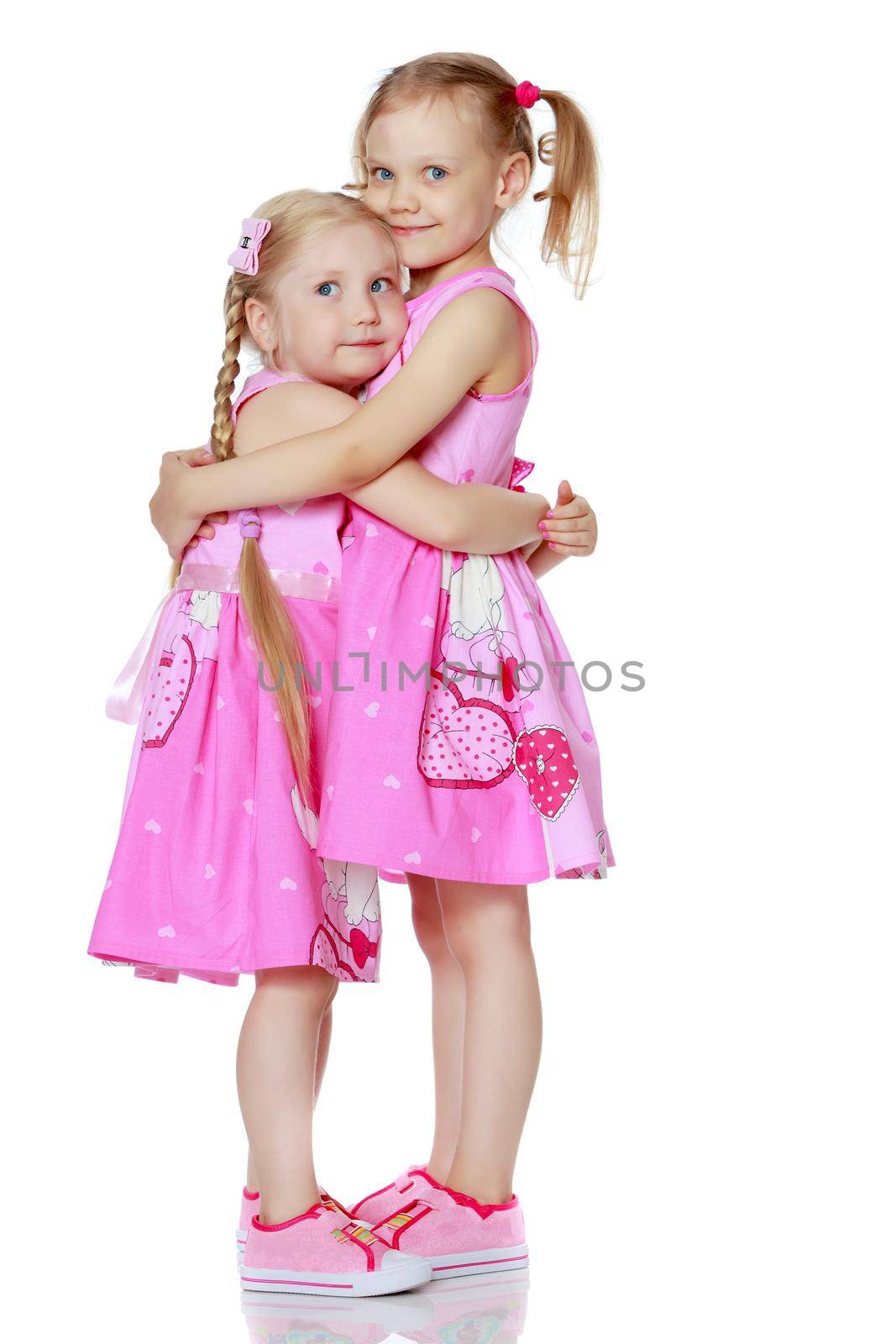 Two cute little girls in full growth by kolesnikov_studio