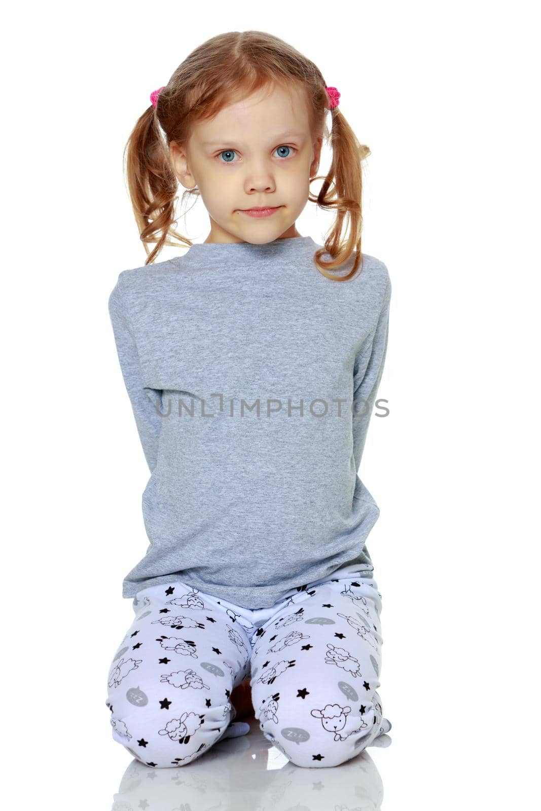 Little girl in pajamas. Concept of family happiness, child, isolated on white background.