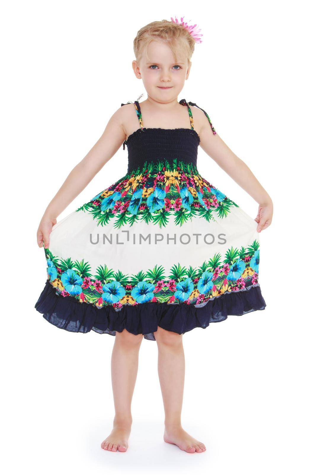 Beautiful little girl in motley dress. Isolated on white background .
